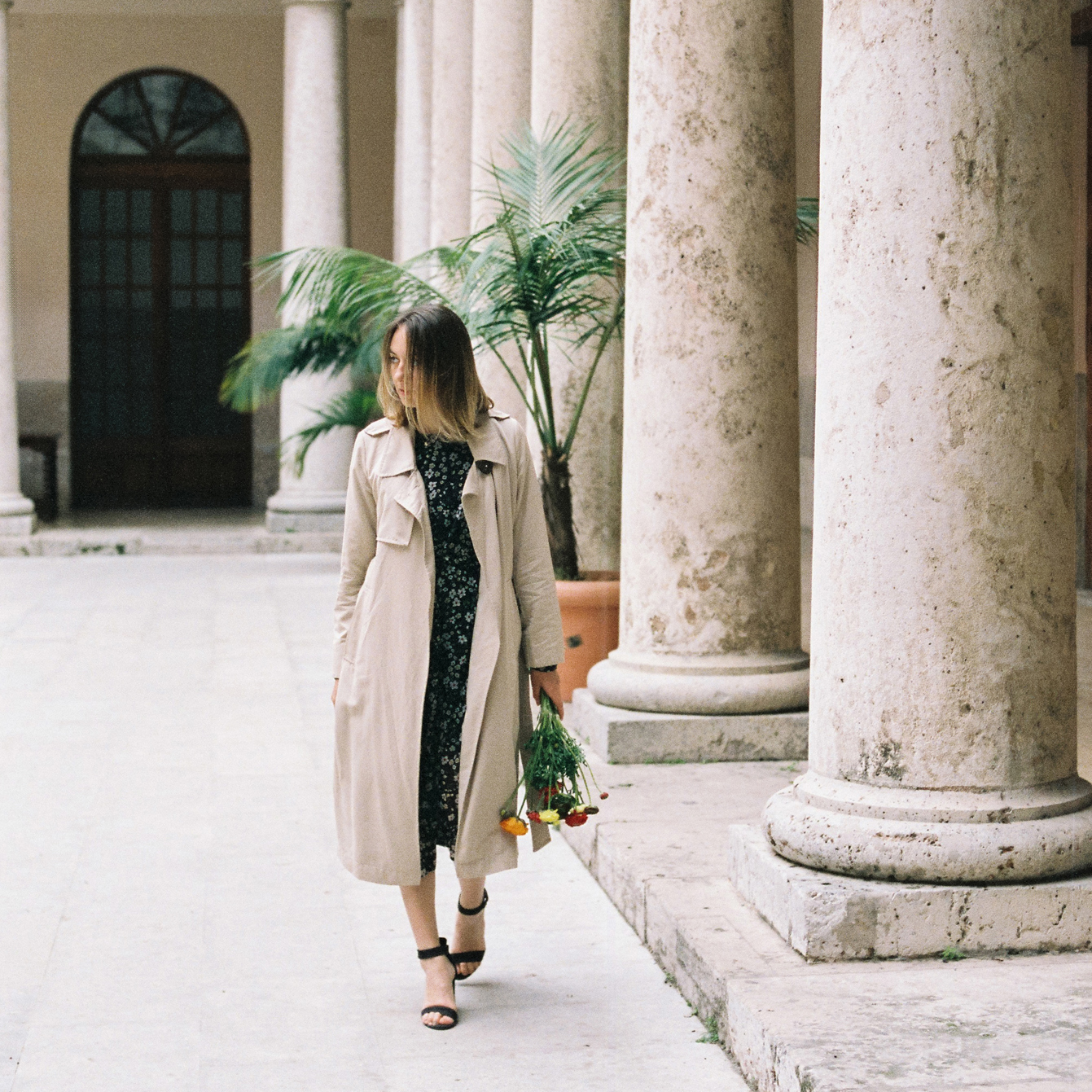 Artistic 35mm film portrait of a woman in soft golden light — Valencia, Spain