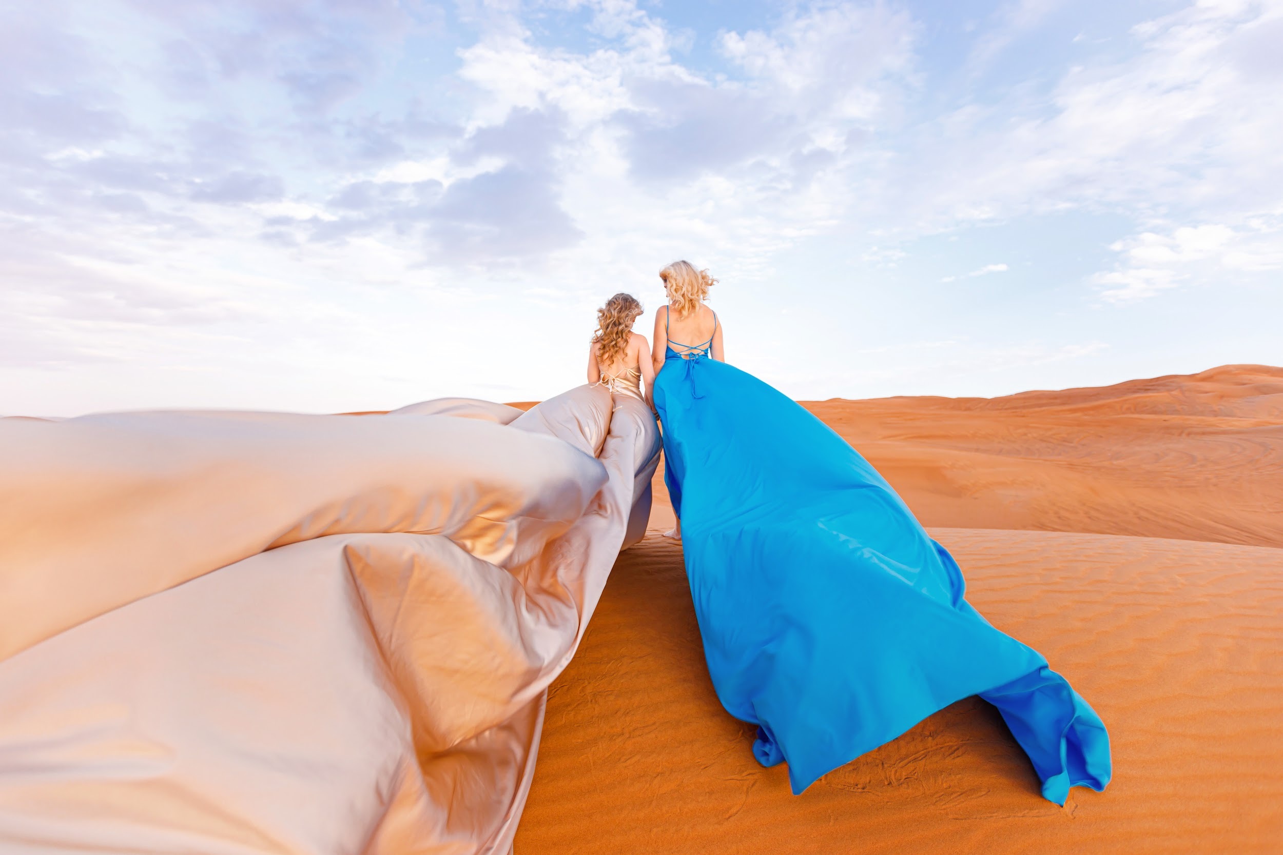 Mother and daughter desert photo session with flying dress