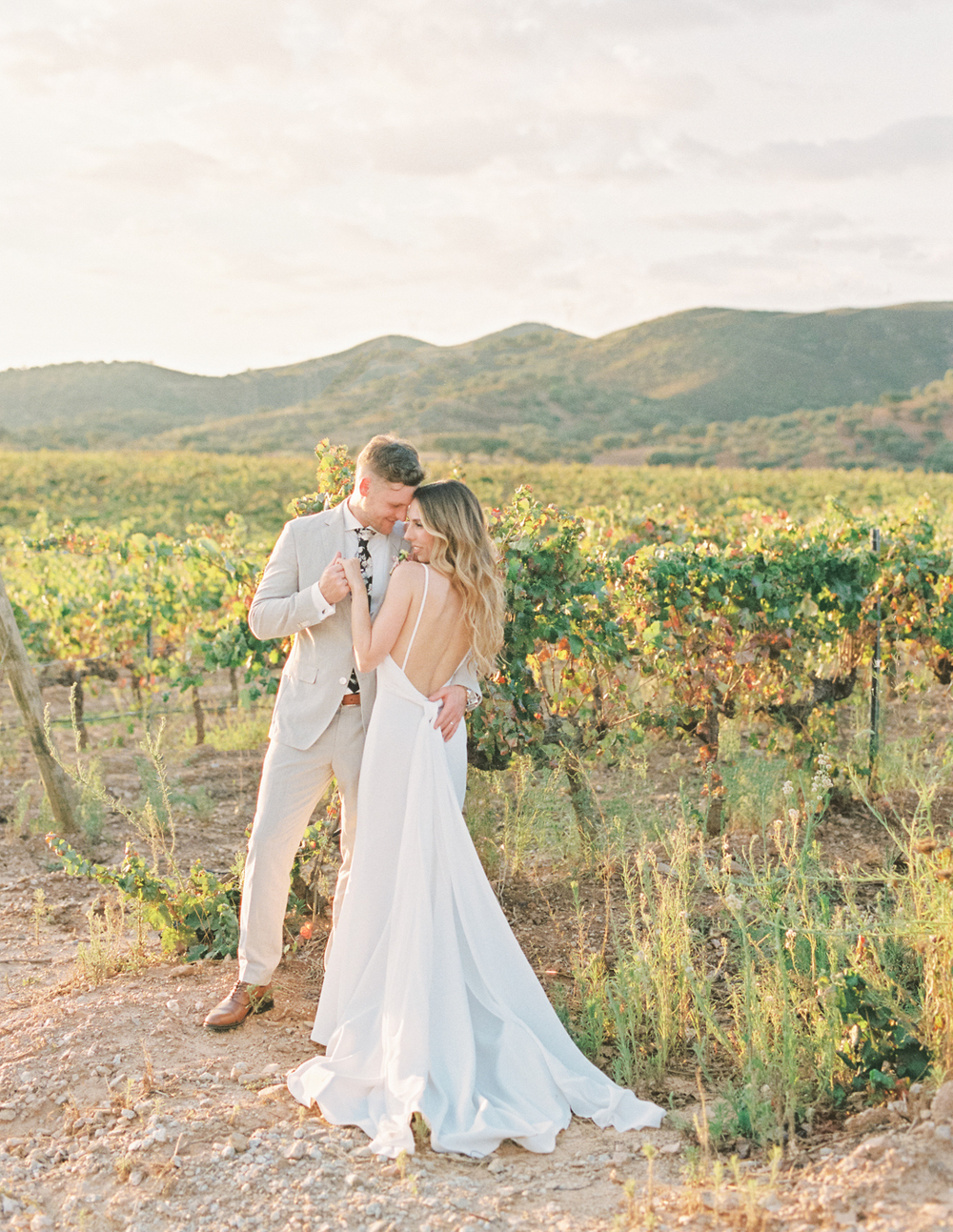 Happy newlywed couple in avineyard setting after their Portugal  wedding