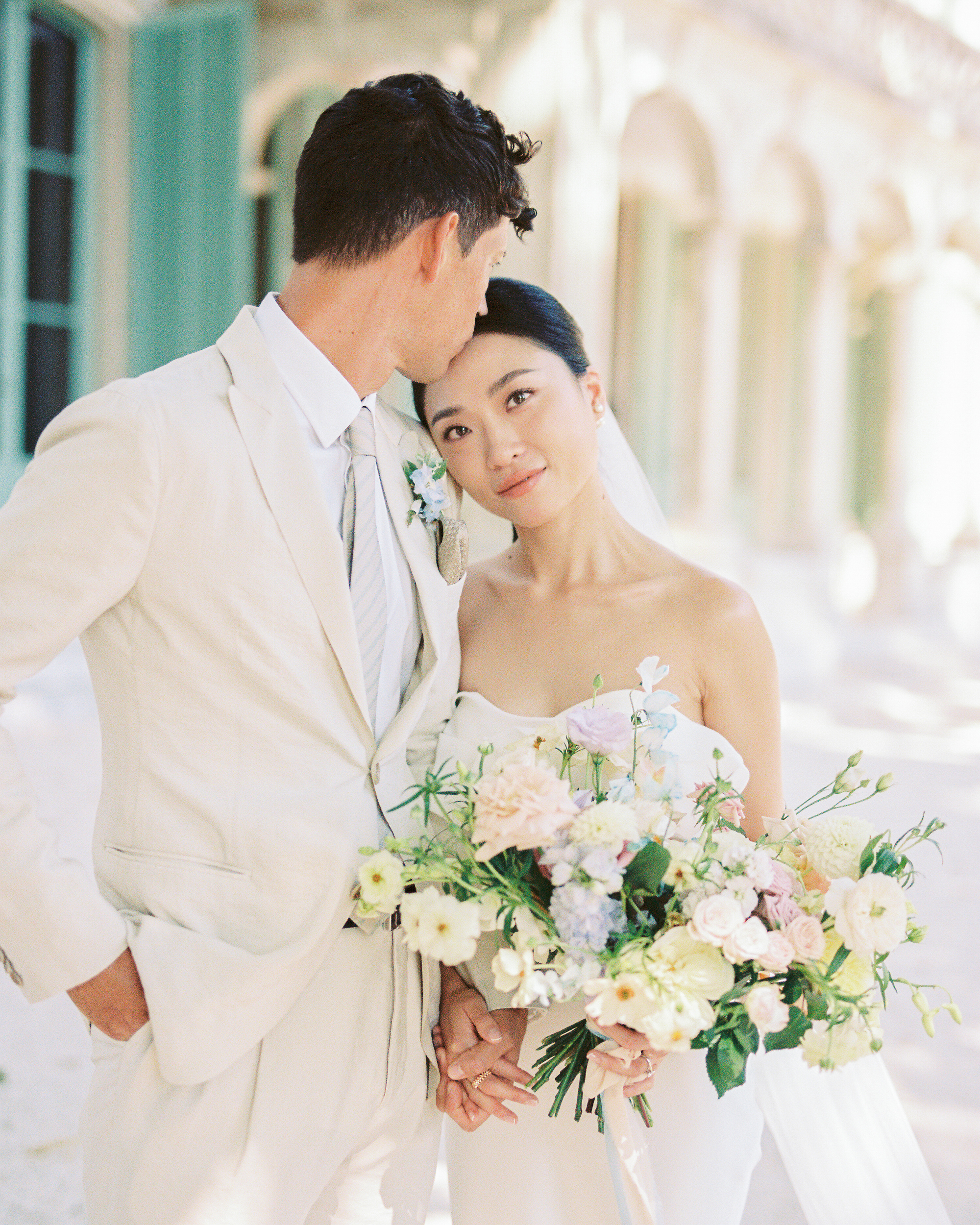 Destination wedding in Provence captured in with soft film tones by Olya Kobruseva
