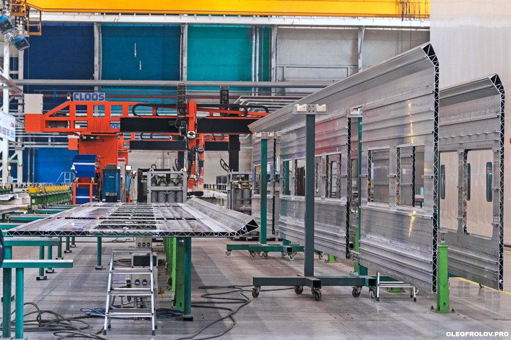 Производство скоростных поездов Ласточка компании Siemens, Моторвагонное депо скоростных поездов Ласточка, промышленный репортаж с предприятия, вагоностроительный завод в Екатеринбурге, железнодорожный транспорт, скоростные поезда, железная дорога,  Промышленная фотосъемка завода Уральские локомотивы, железнодорожный транспорт, локомотив, электричка, Ласточка, поезд, железная дорога, производство поездов, производство локомотивов, репортаж на заводе, Екатеринбург, поезда сименс, поезда ласточка, скоростной поезд, рекламная фотосъемка поезда, подвижной состав, сборочный конвейер, сборка проездов, вагоны сименс, вагоны ласточка,  новые поезда, фотосъемка поездов, промышленный фотограф Екатеринбурга, Промышленный репортаж, Производственный репортаж, Репортажно-постановочная фотосъёмка на производстве, постановочная фотосъемка промышленности, промышленный фотограф, промышленная съемка, промышленная аэросъемка, промышленная фотография, промышленность, фотограф промышленности, фотограф промышленных объектов, фотосъемка рабочего процесса, фотосъемка завода, аэросъемка атомной станции, аэросъемка промышленно предприятия, промышленная съемка строительного объекта,   