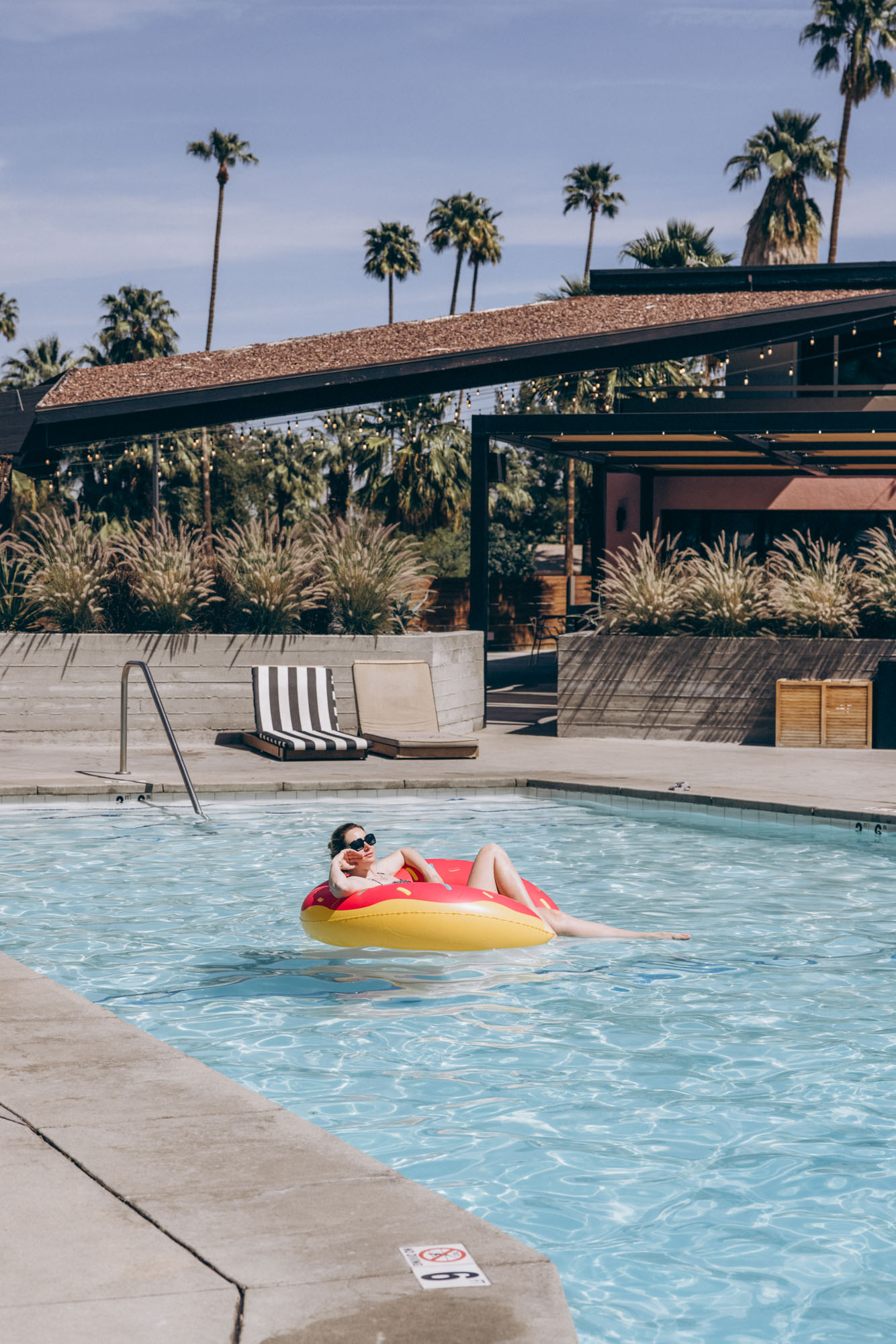 The V Palm Springs by sonder, beautiful girl relaxing in the pool