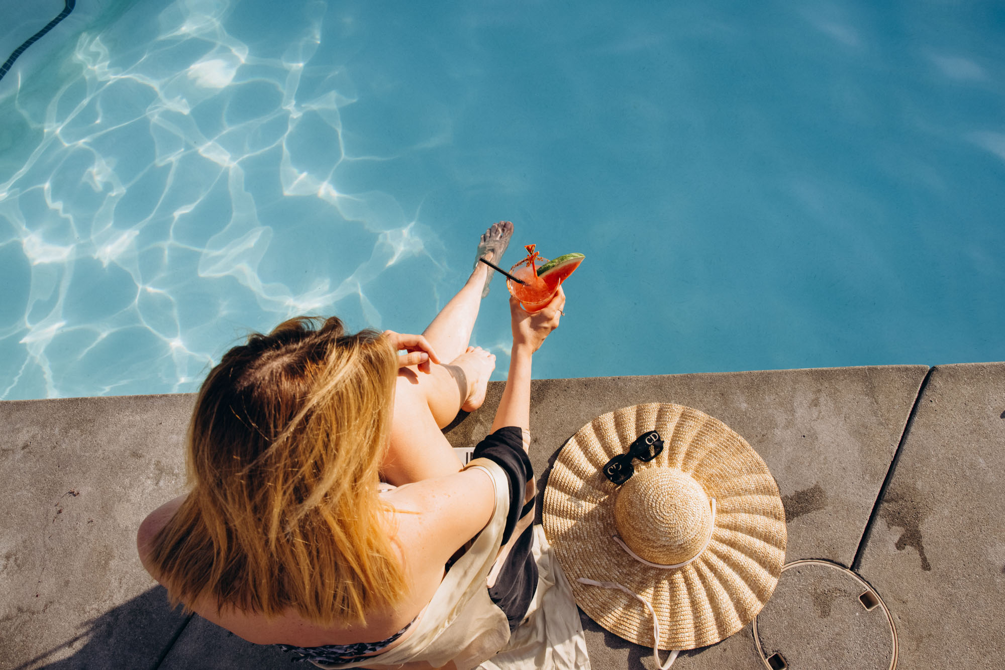 The V Palm Springs by sonder, beautiful girl relaxing in the pool with coctail