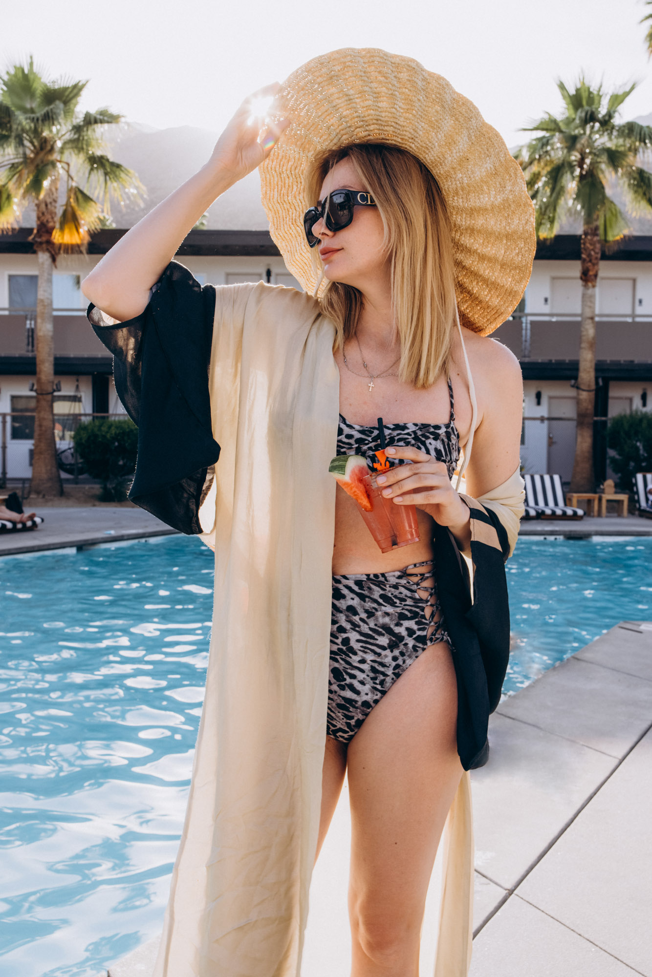 The V Palm Springs by sonder, portrait of the beautiful girl near the pool with mountains on the background