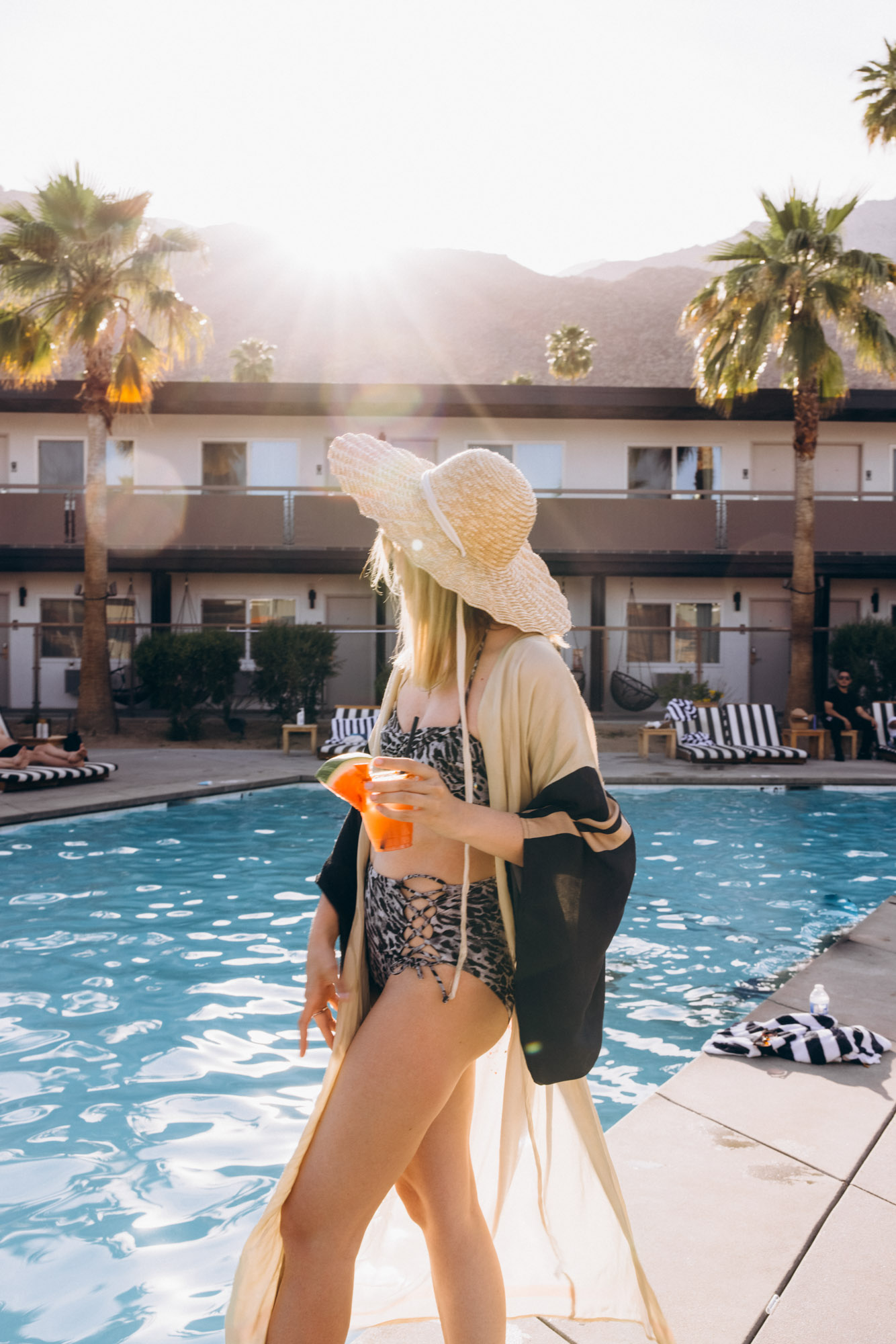 The V Palm Springs by sonder, picture of the beautiful girl near the pool with mountains on the background