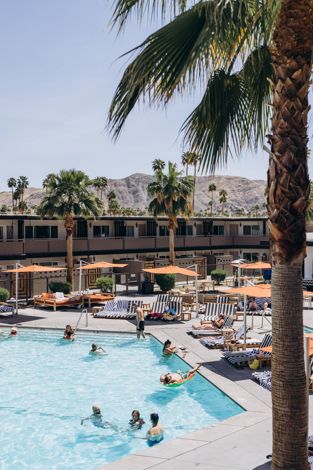 The V Palm Springs by Sonder, exterior, guests are relaxing near the pool