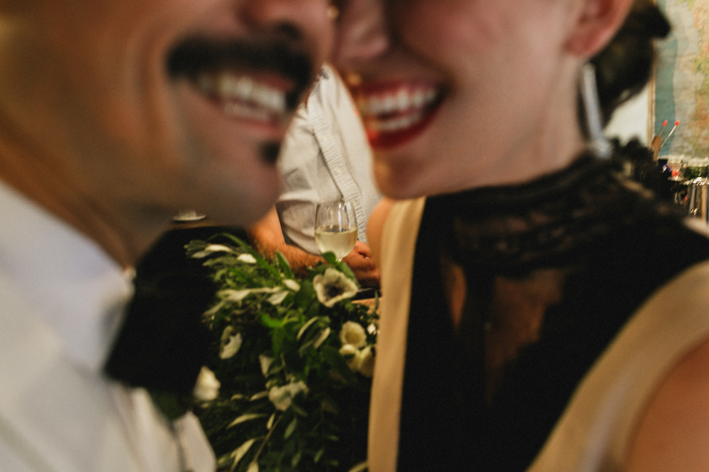 Close up shot of the bride and groom at a bar on their wedding day in Brooklyn NY