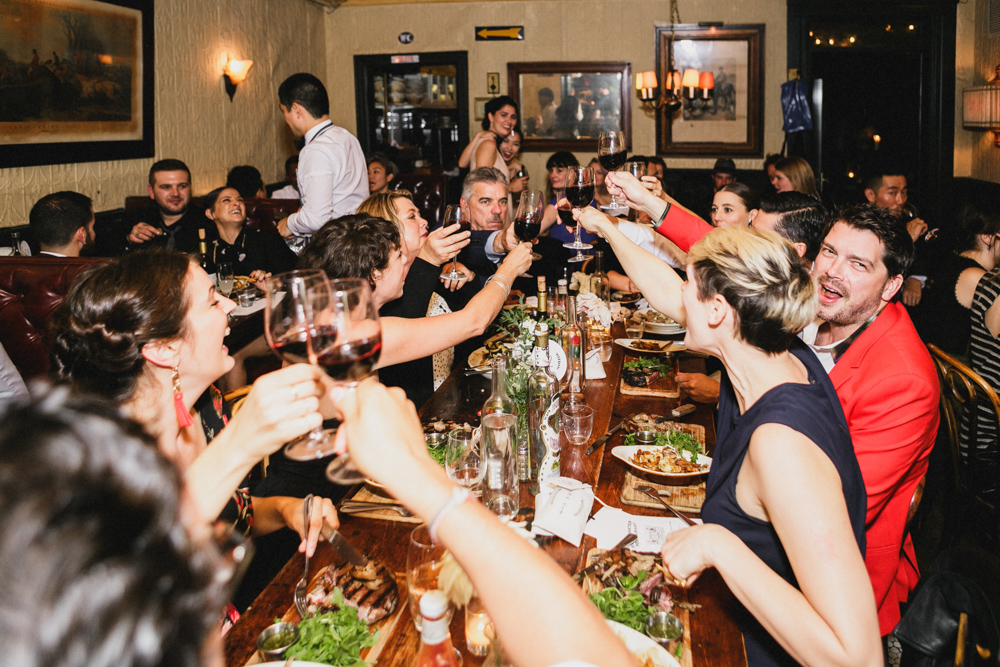 Guests enjoying an intimate wedding reception and dinner at Sweetwater restaurant in Brooklyn NY