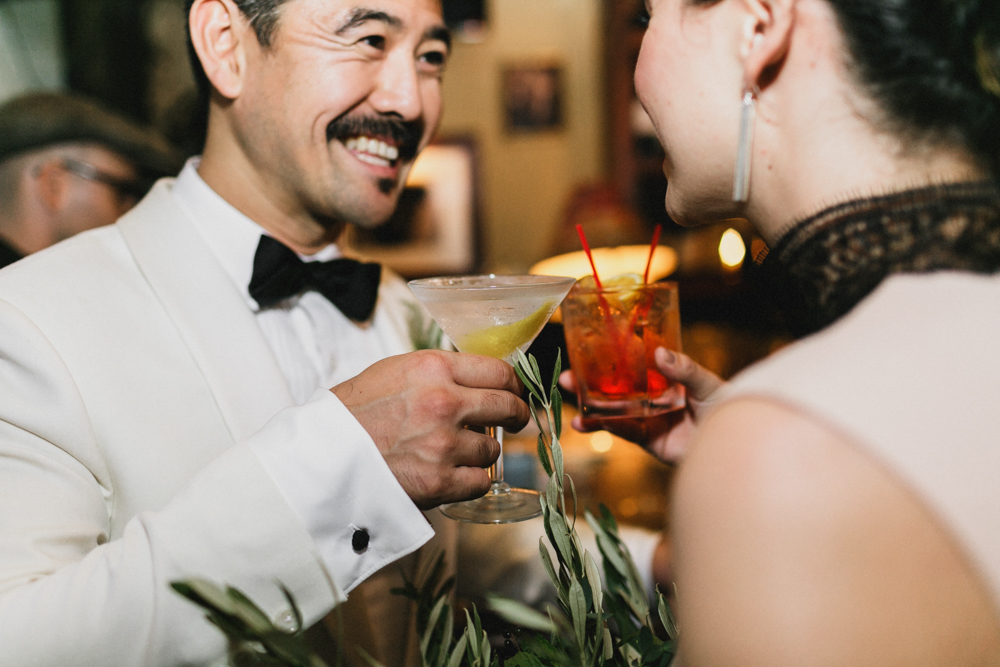 Happy bride and groom having drinks at their wedding reception at Sweetwater, Brooklyn NY