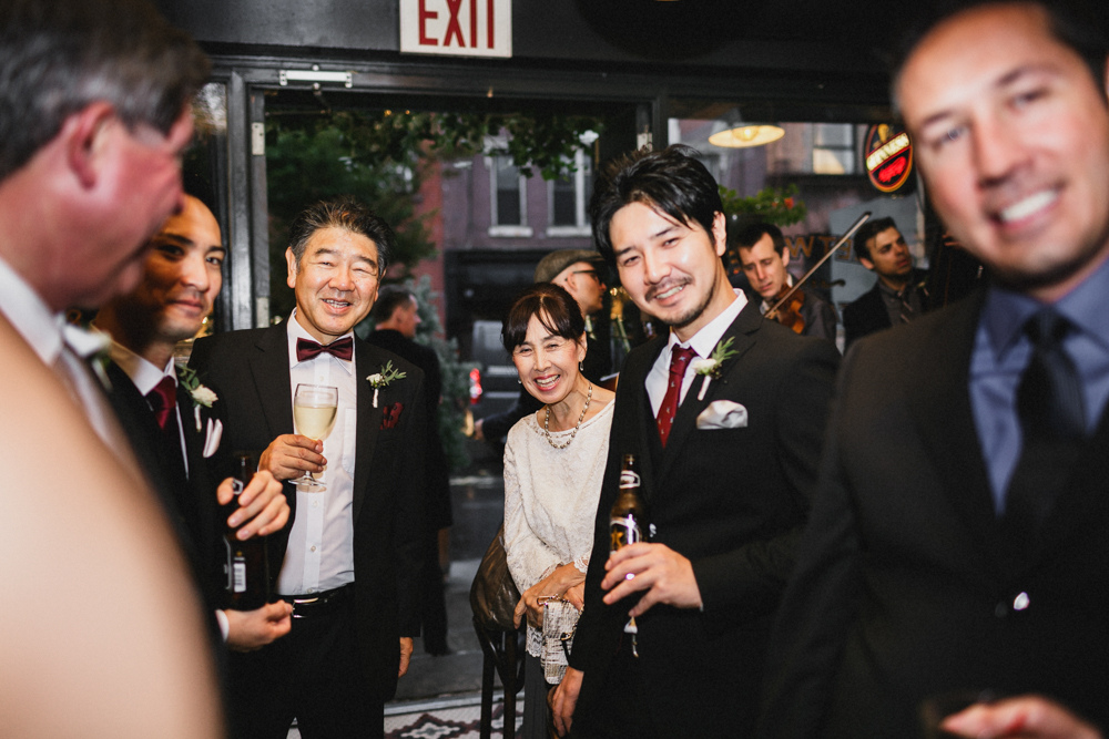 Excited guests enjoying the wedding reception at Sweetwater restaurant. Brooklyn NY