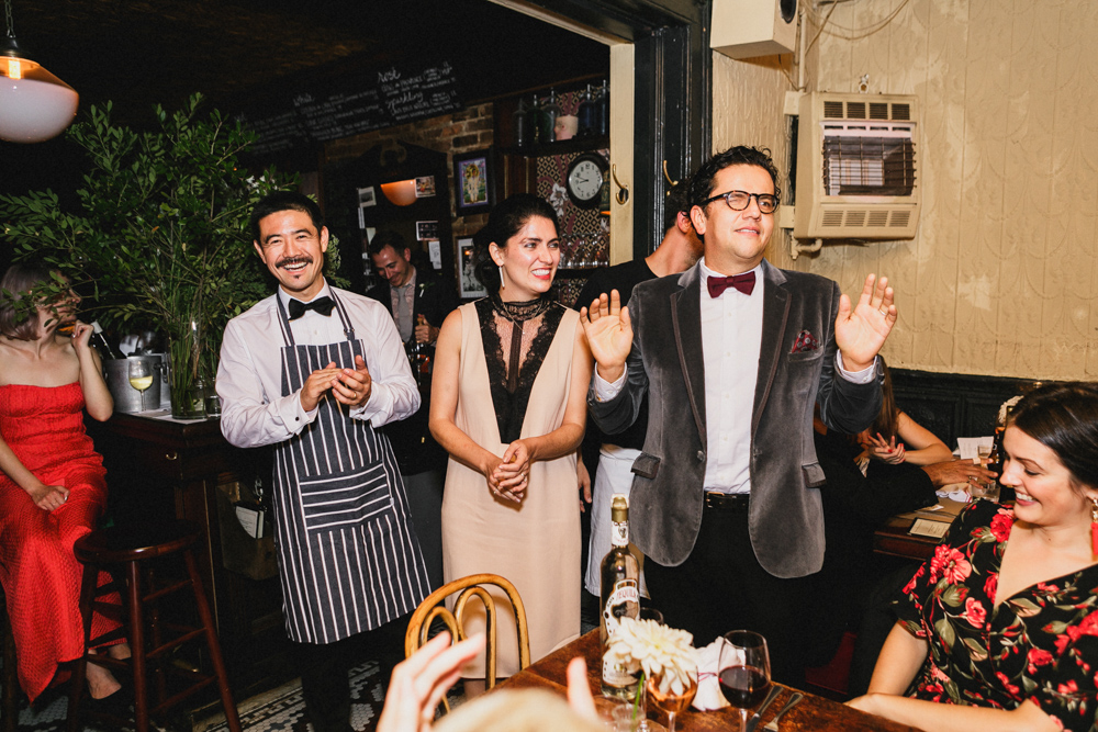 Guests and couple enjoying an intimate wedding reception at Sweetwater restaurant in Brooklyn NY