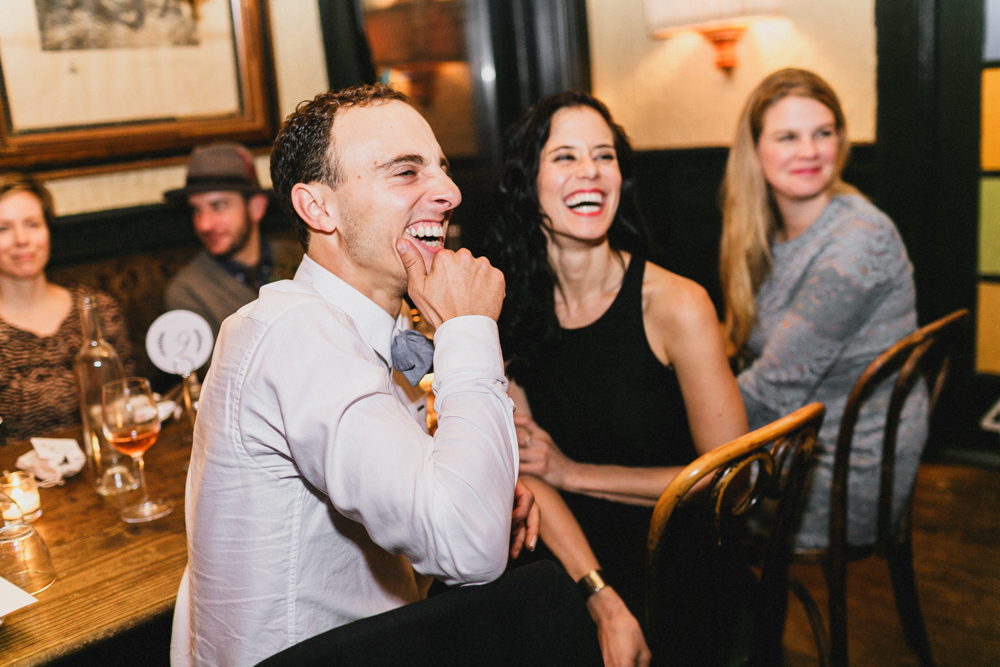 Emotional guests listening to wedding speeches at a wedding reception at Sweetwater restaurant Brooklyn NY