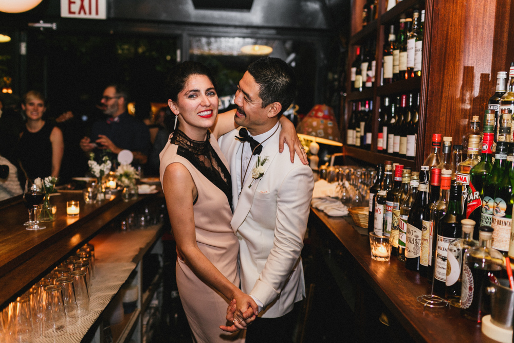 Bride and groom enjoying their reception and celebration at Sweetwater restaurant Brooklyn NY