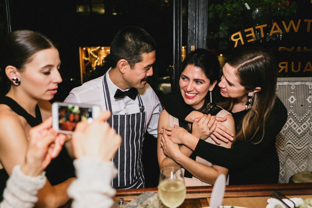 Bride and groom enjoying their wedding reception and friends at Sweetwater restaurant, Brooklyn NY