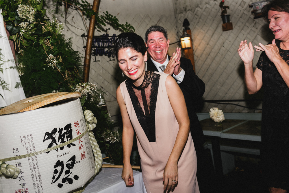 Excited bride during a traditional Japanese wedding ceremony at Sweetwater restaurant Brooklyn NY