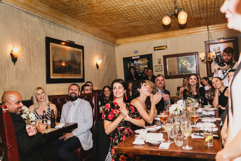 Excited guests enjoying a wedding reception at Sweetwater restaurant in Brooklyn NY