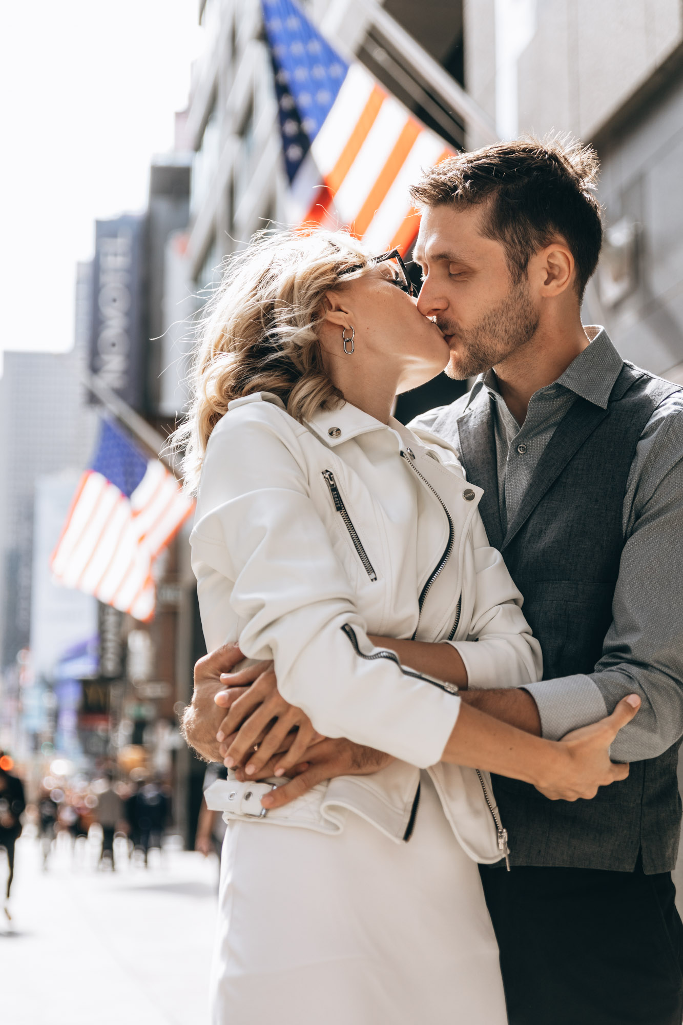 Happy bride and groom kissing in the middle of a street in Manhattan, NYC