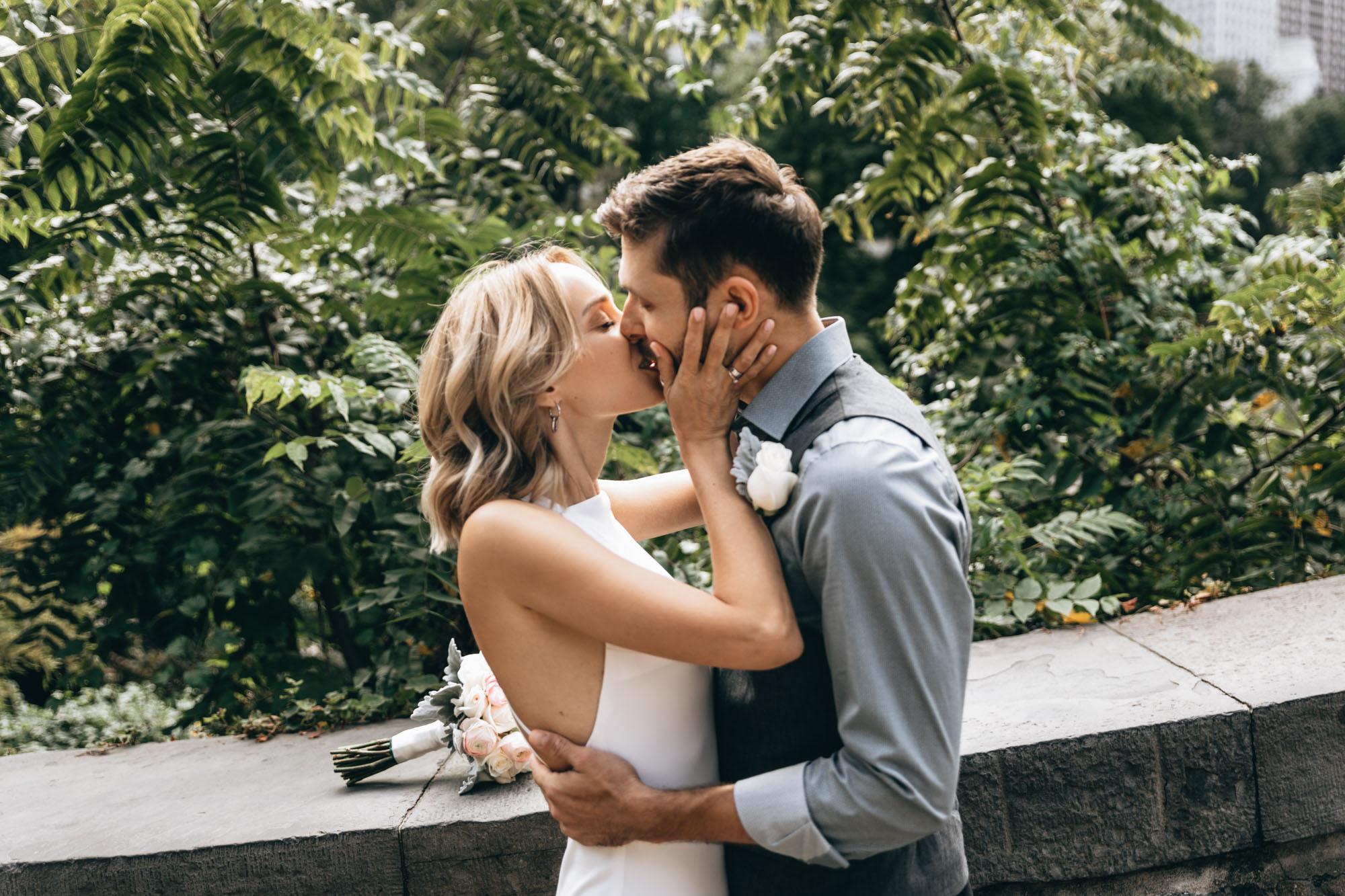 Bride and groom kissing in Central Park during their small elopement, Manhattan, NY