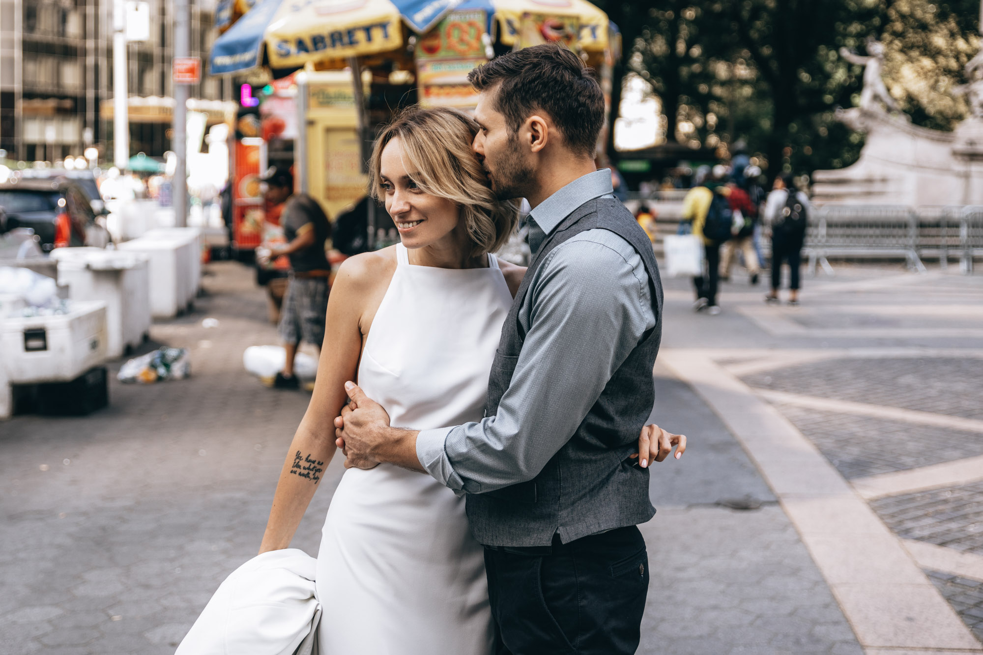 Bride and groom standing near Central Park on their wedding day, Manhattan