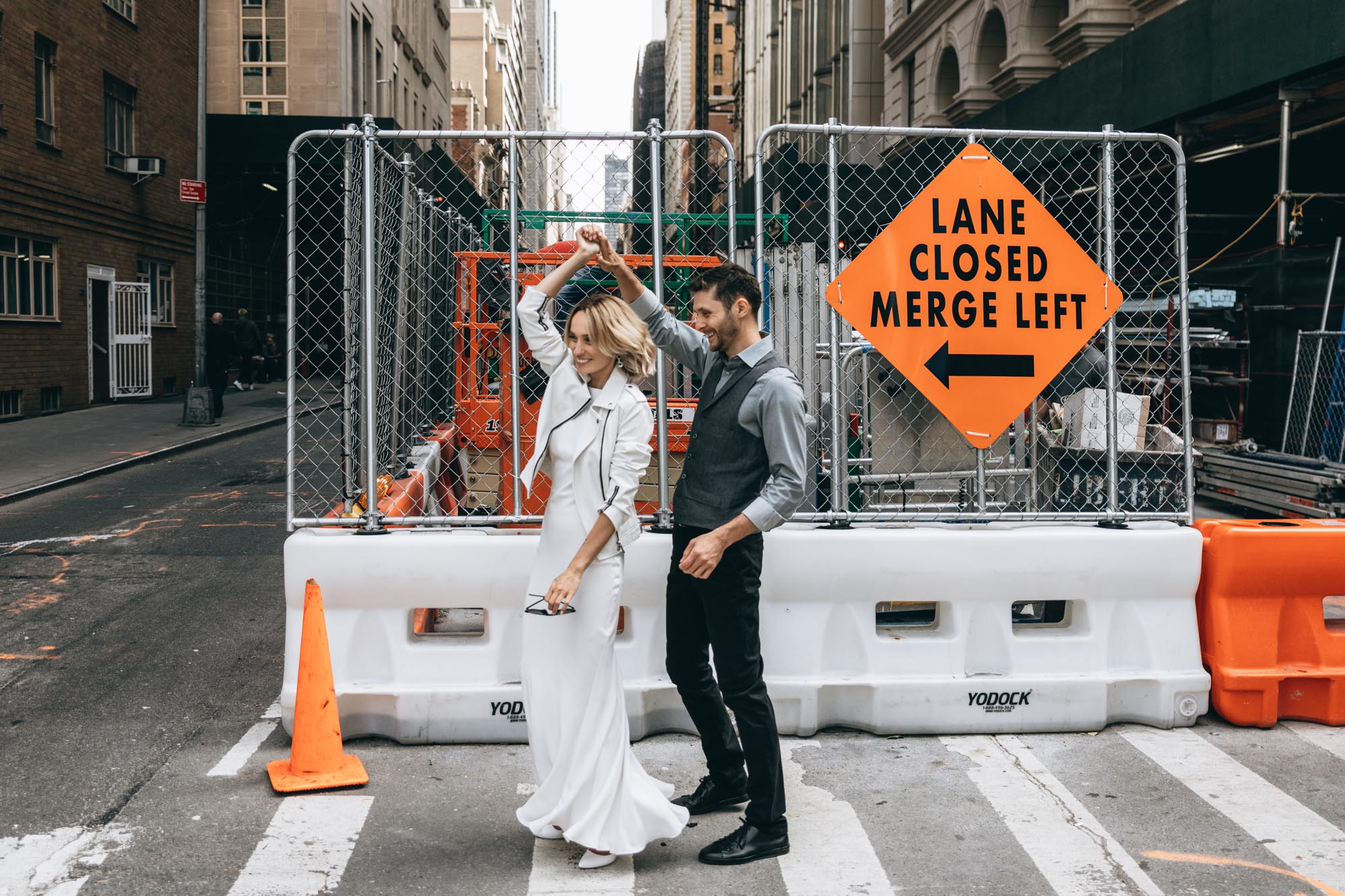 Bride and groom dancing in the middle of the street in Manhattan on their elopement day