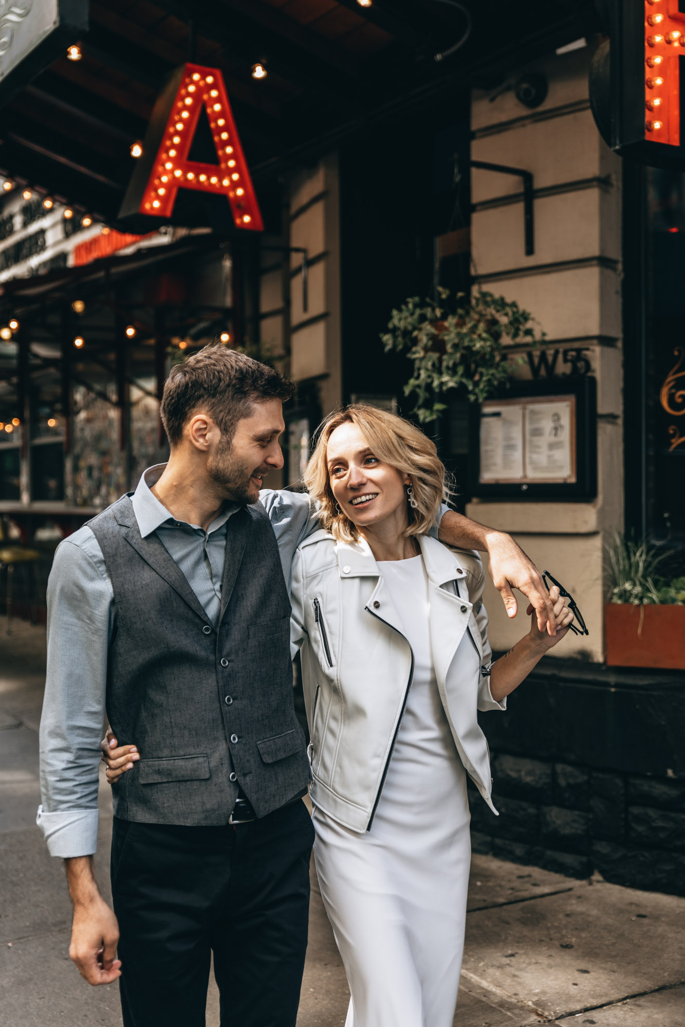 bride and groom walking in Manhattan NYC on their elopement wedding day.