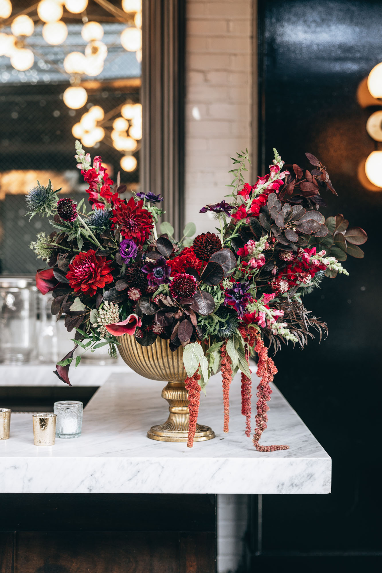 Stunning dark and moody floral arrangement centerpiece at 501 Union, Brooklyn, NY