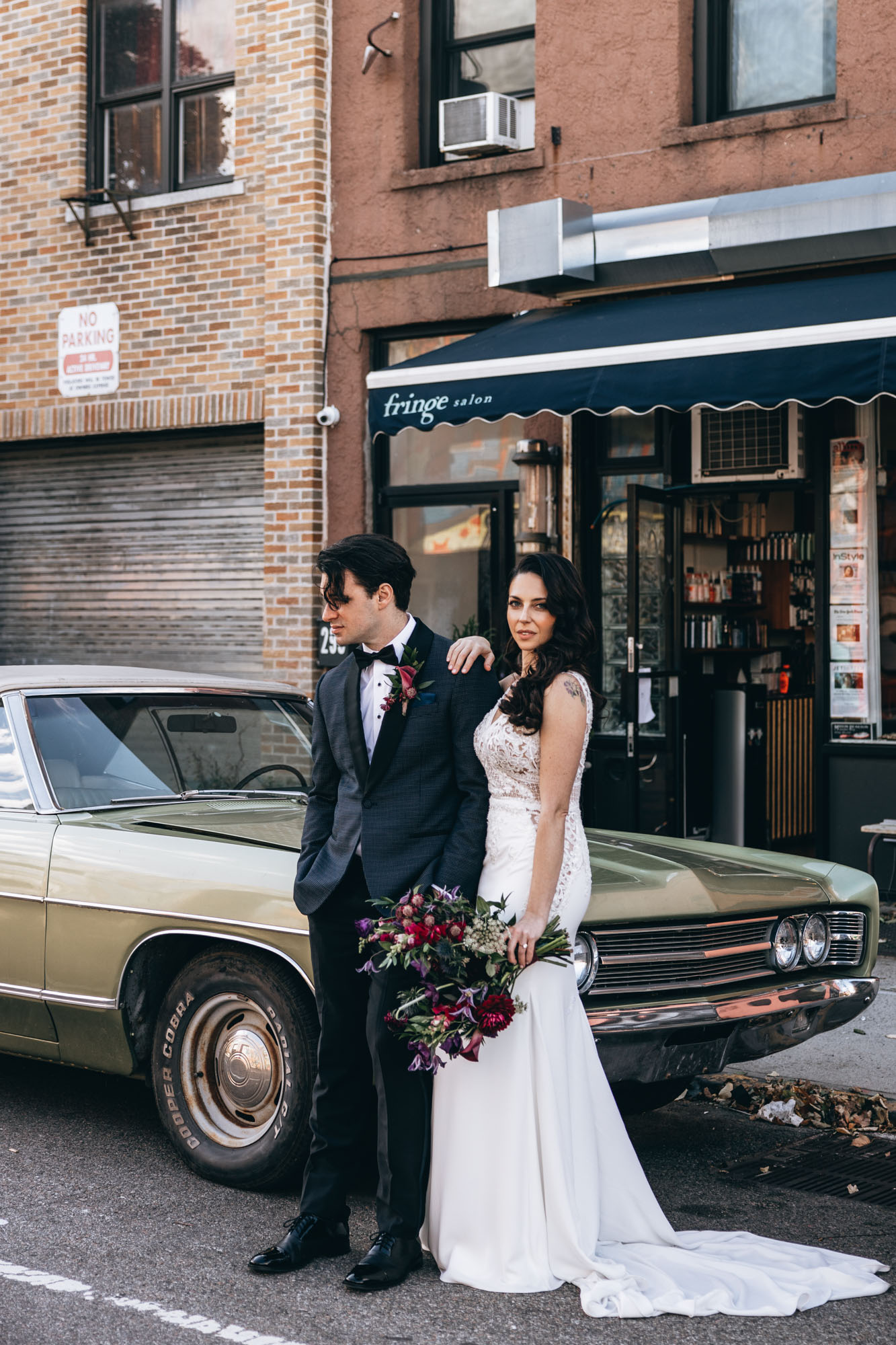 Stunning bride and groom next to a vintage car in Brooklyn NY