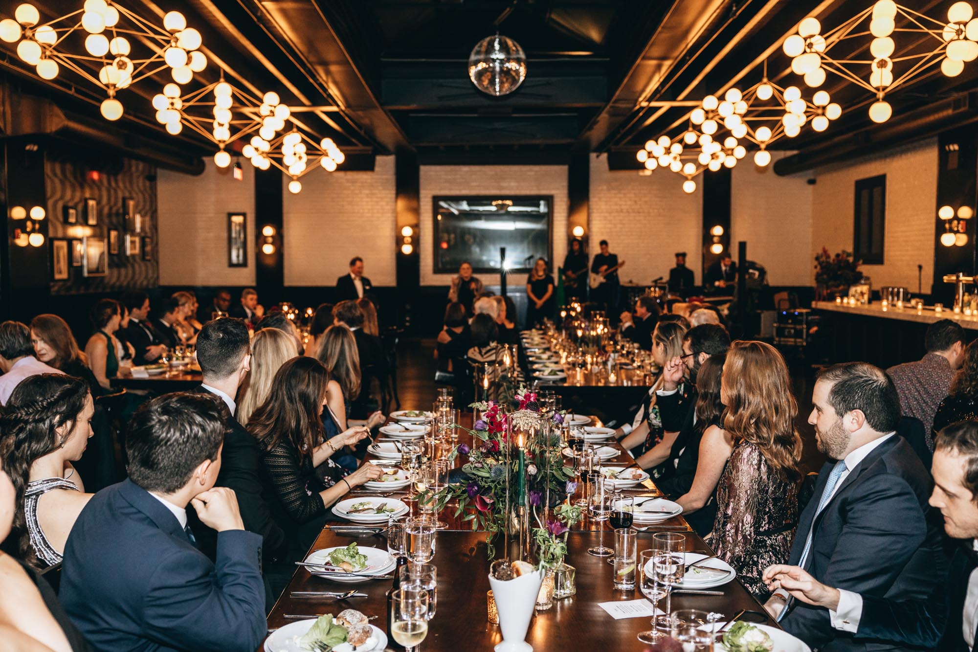 Dinner and reception at night at 501 Union wedding in Brooklyn NY