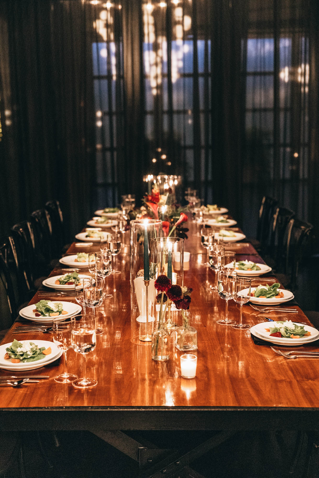 Dark and bold tables with floral centerpieces at a wedding in 501 Union, Brooklyn, NY