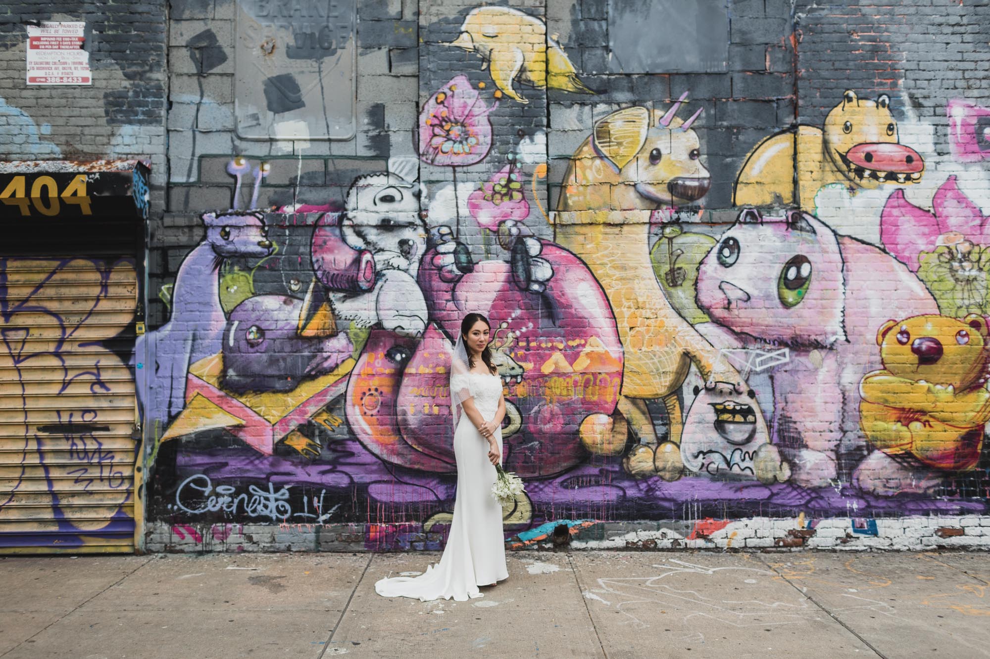 Portrait of the bride with amazing mural on the background.  Wedding in Williamsburg, Brooklyn