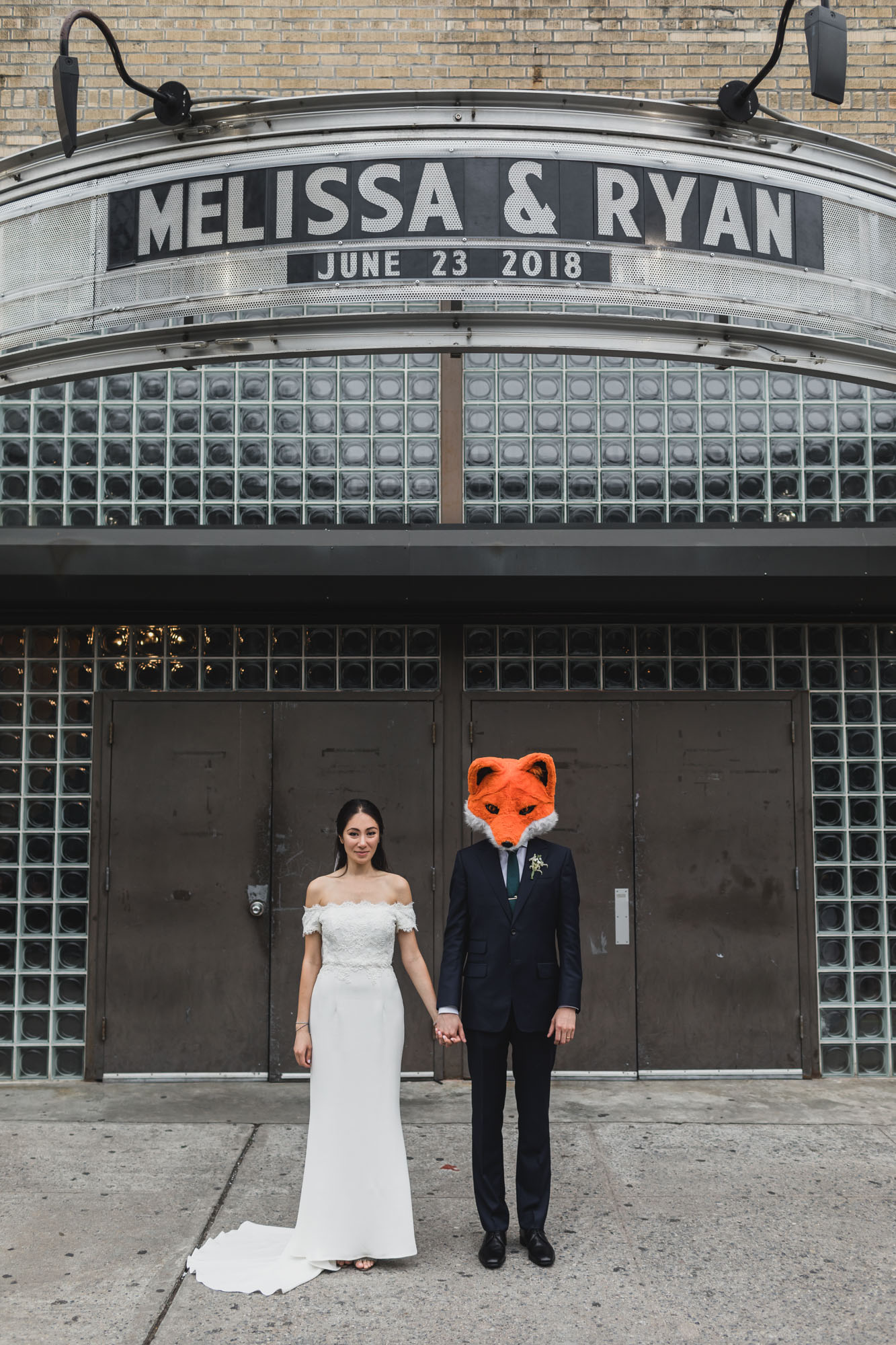 Couple kissing in front of main entrance music of Hall of Williamsburg, Wedding Williamsburg, Brooklyn.