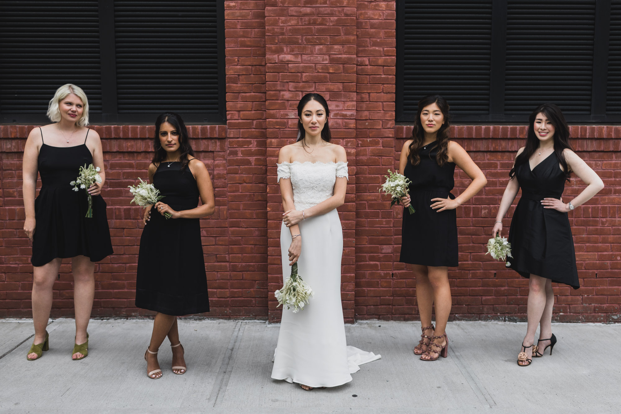 Bride and her bridesmaid are rocking streets of brooklyn .  Wedding in Williamsburg, Brooklyn