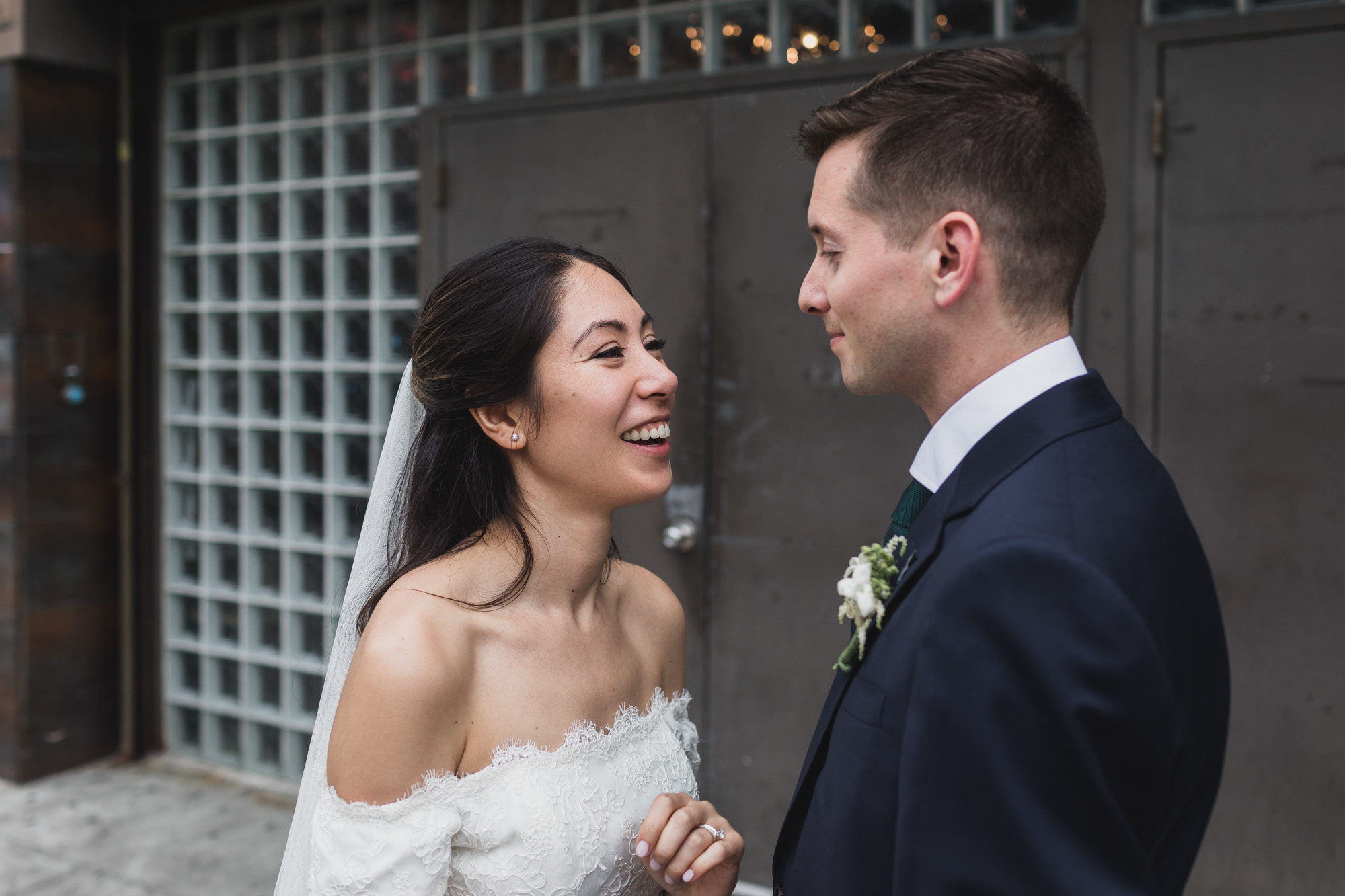 Couple kissing in front of main entrance music of Hall of Williamsburg, Wedding Williamsburg, Brooklyn.