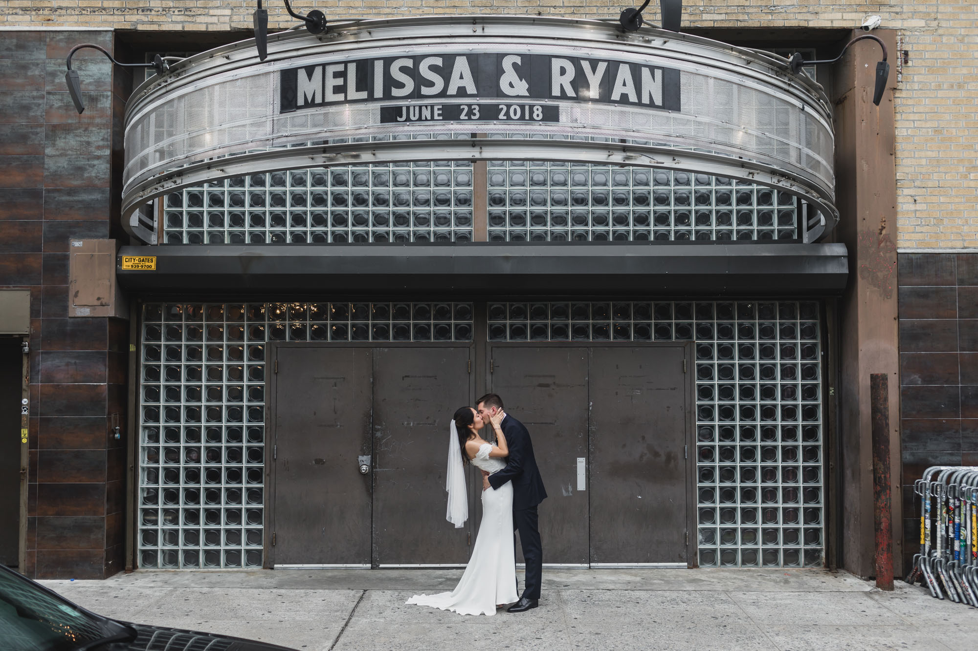 Couple kissing in front of main entrance music of Hall of Williamsburg, Wedding Williamsburg, Brooklyn.