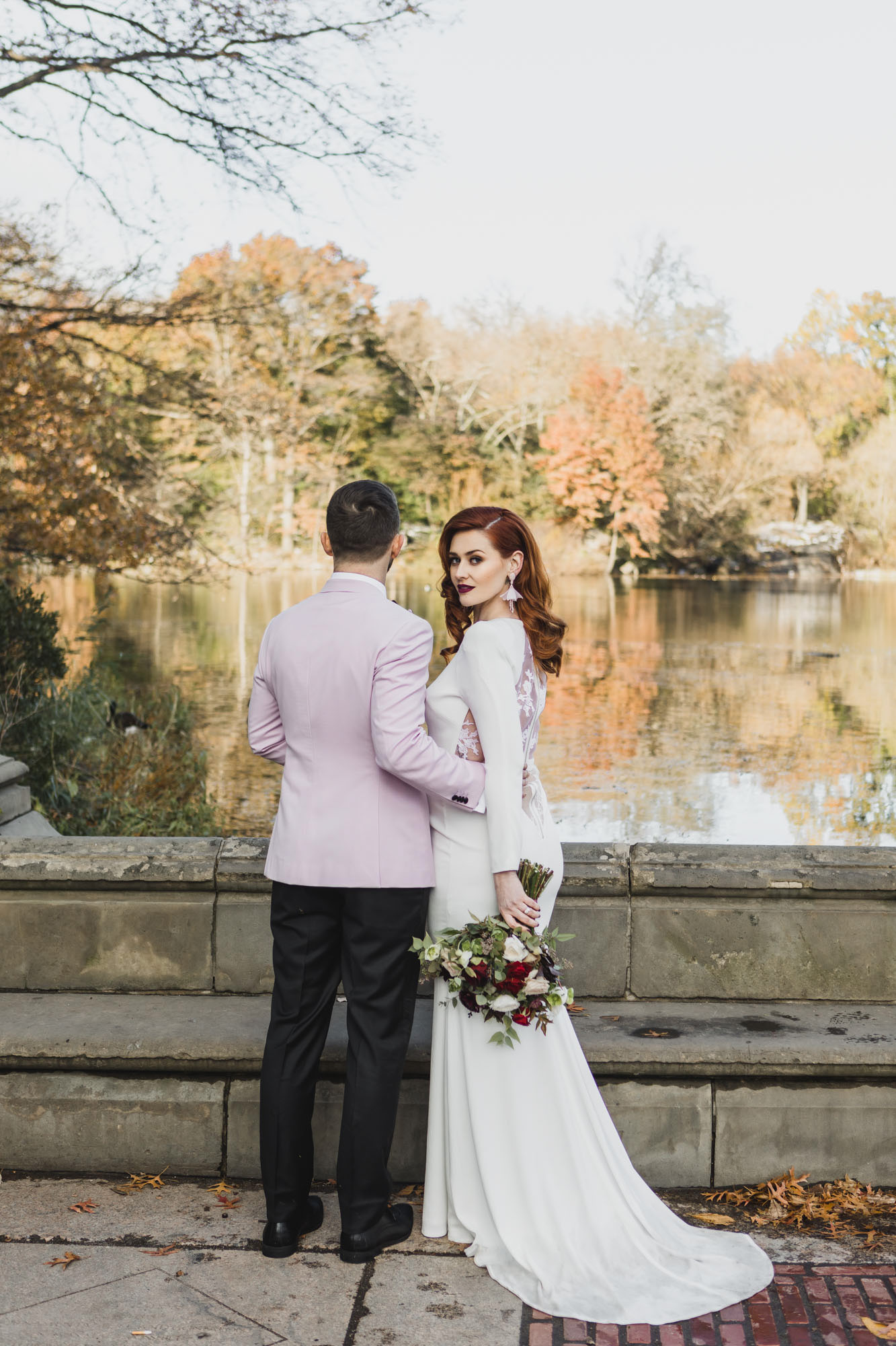 Stunning Aussie bride and groom in light pink outfits during their elopement at Bethesda Fountain and Terrace, Central Park. Manhattan, NY