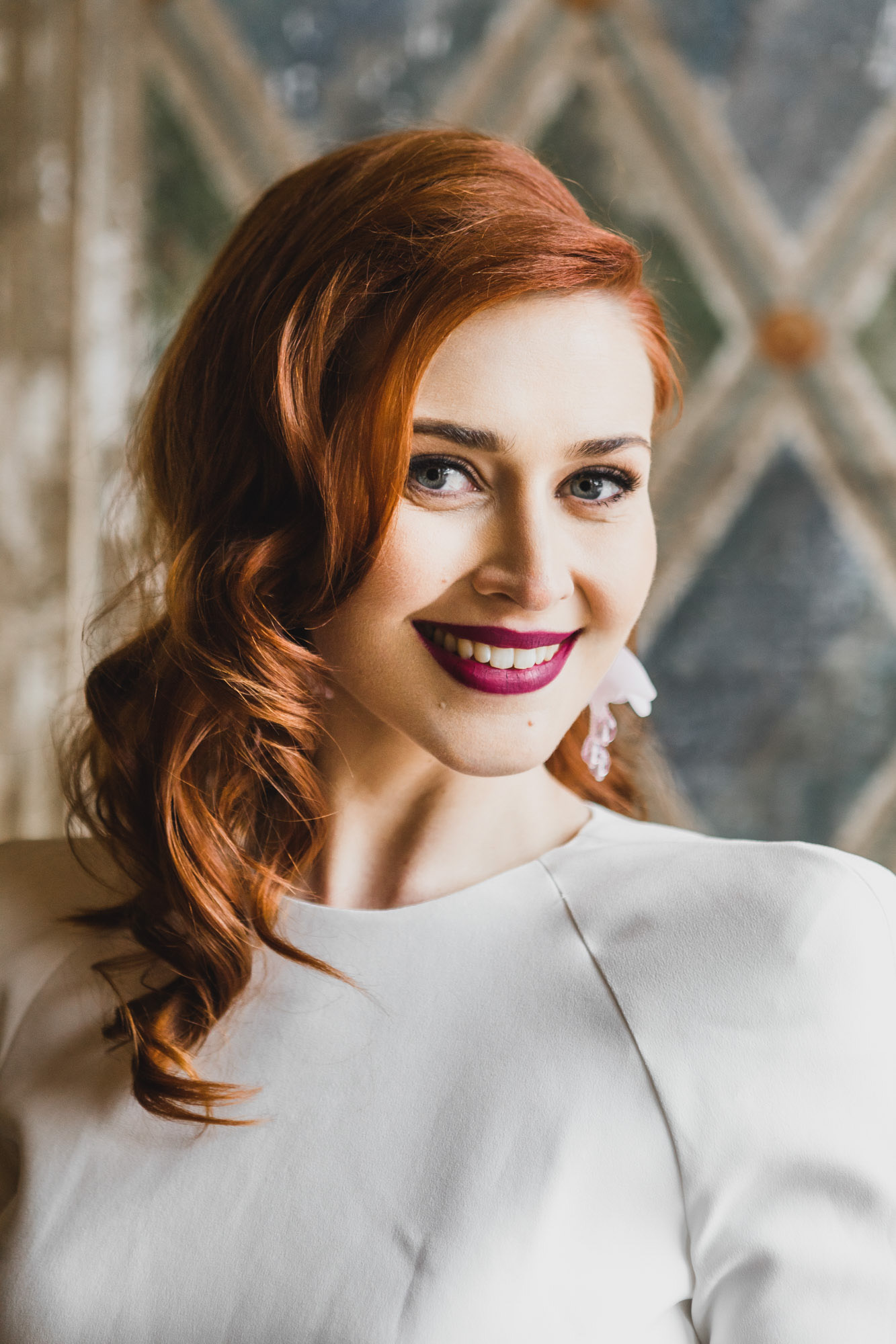 Portrait of an Aussie redhead bride on her wedding day at  Bethesda Fountain and Terrace, Central Park. Manhattan, NY
