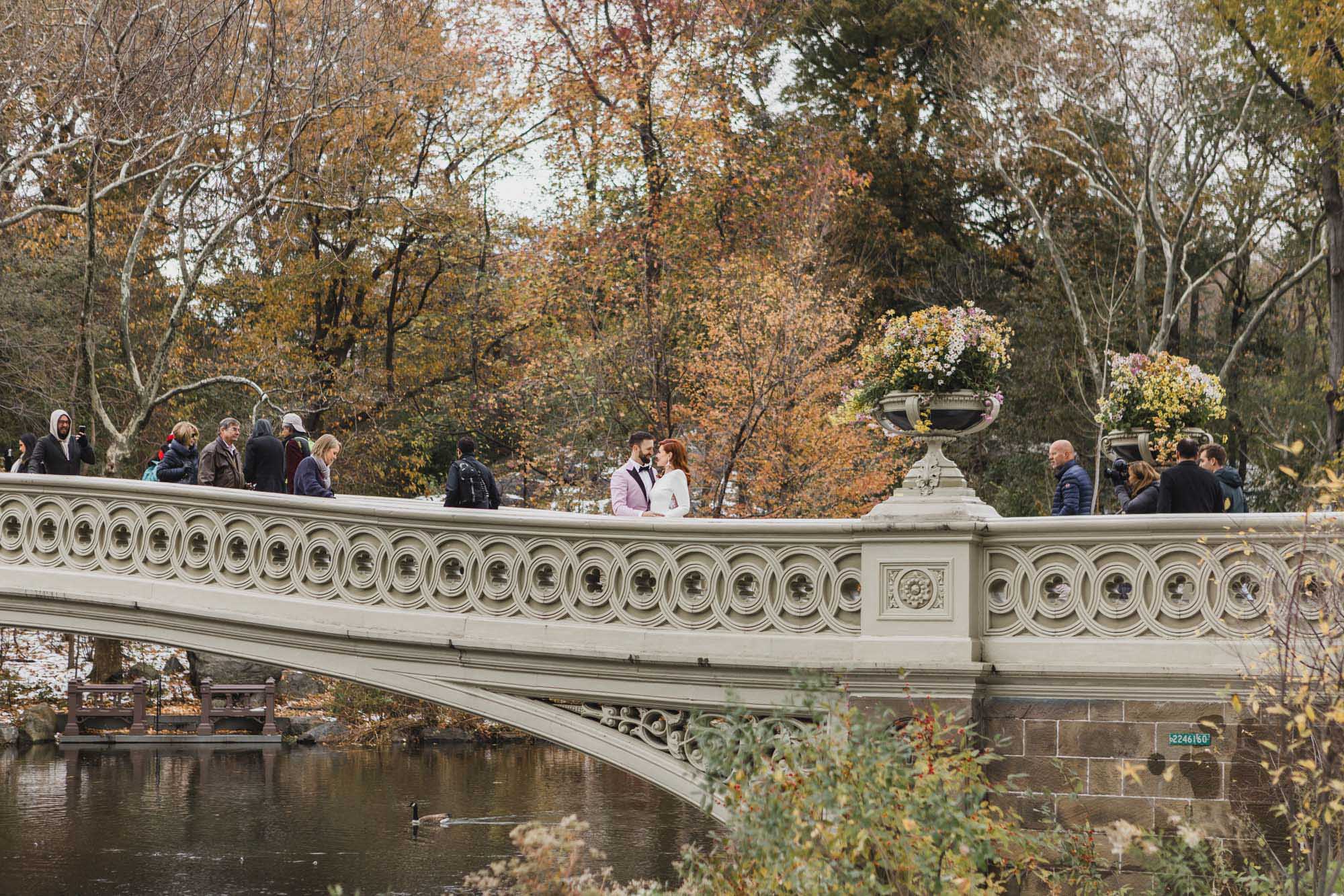 Bride and groom during their elopement wedding at Bethesda Fountain and Terrace and Proposal Bridge, Central Park. Manhattan, NY