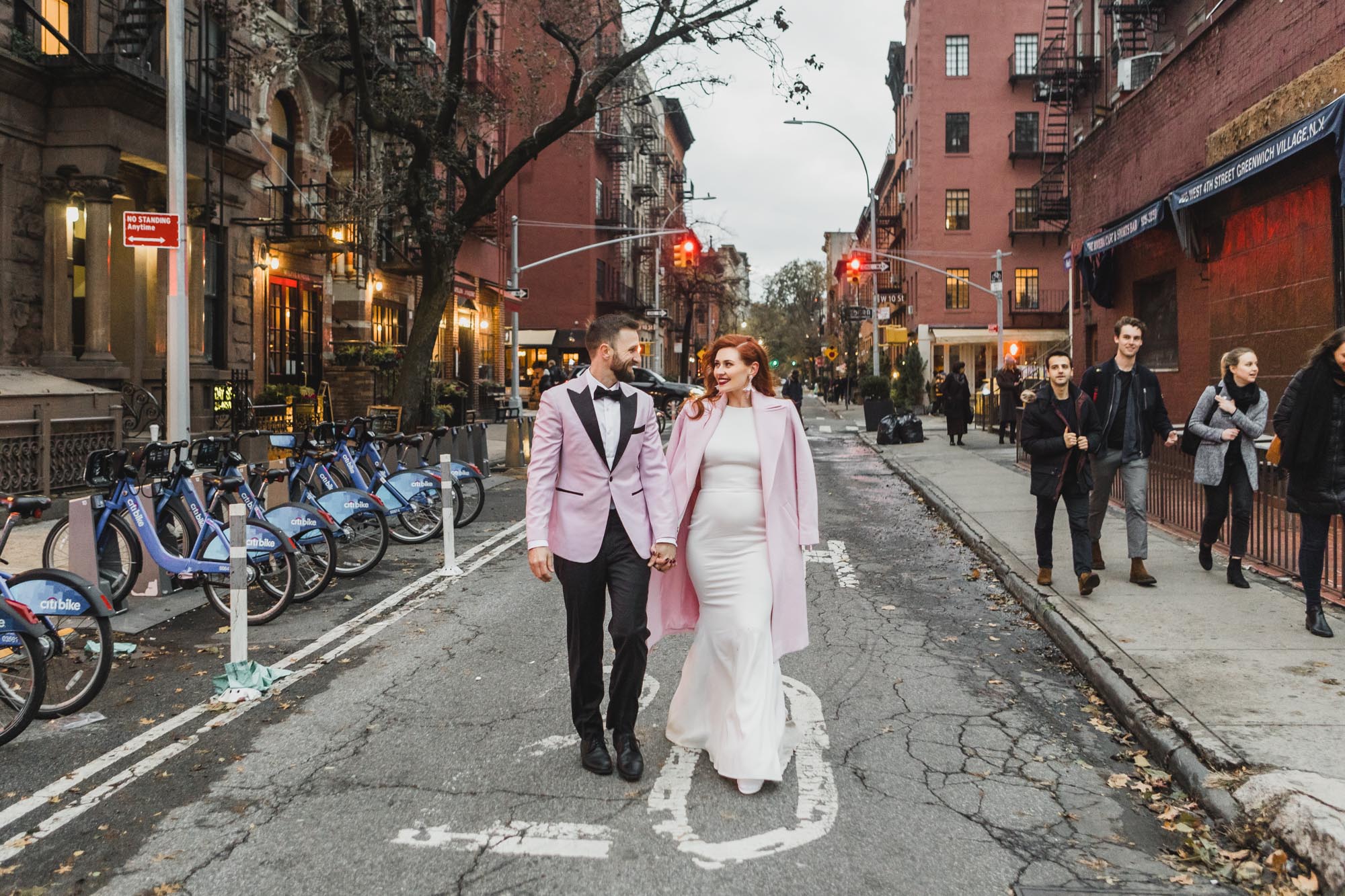 Aussie bride and groom in light pink outfits during their NYC elopement. West Village, Manhattan NY