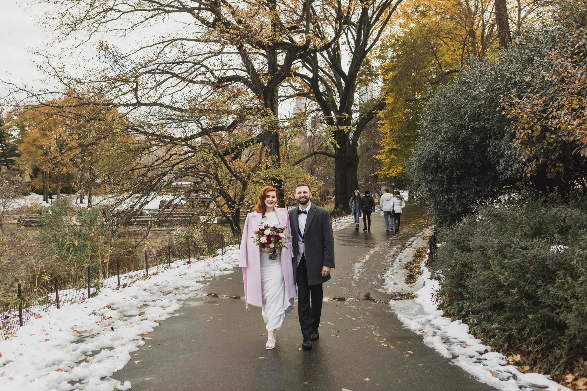 Aussie bride and groom walking in Central Park. Manhattan, NY