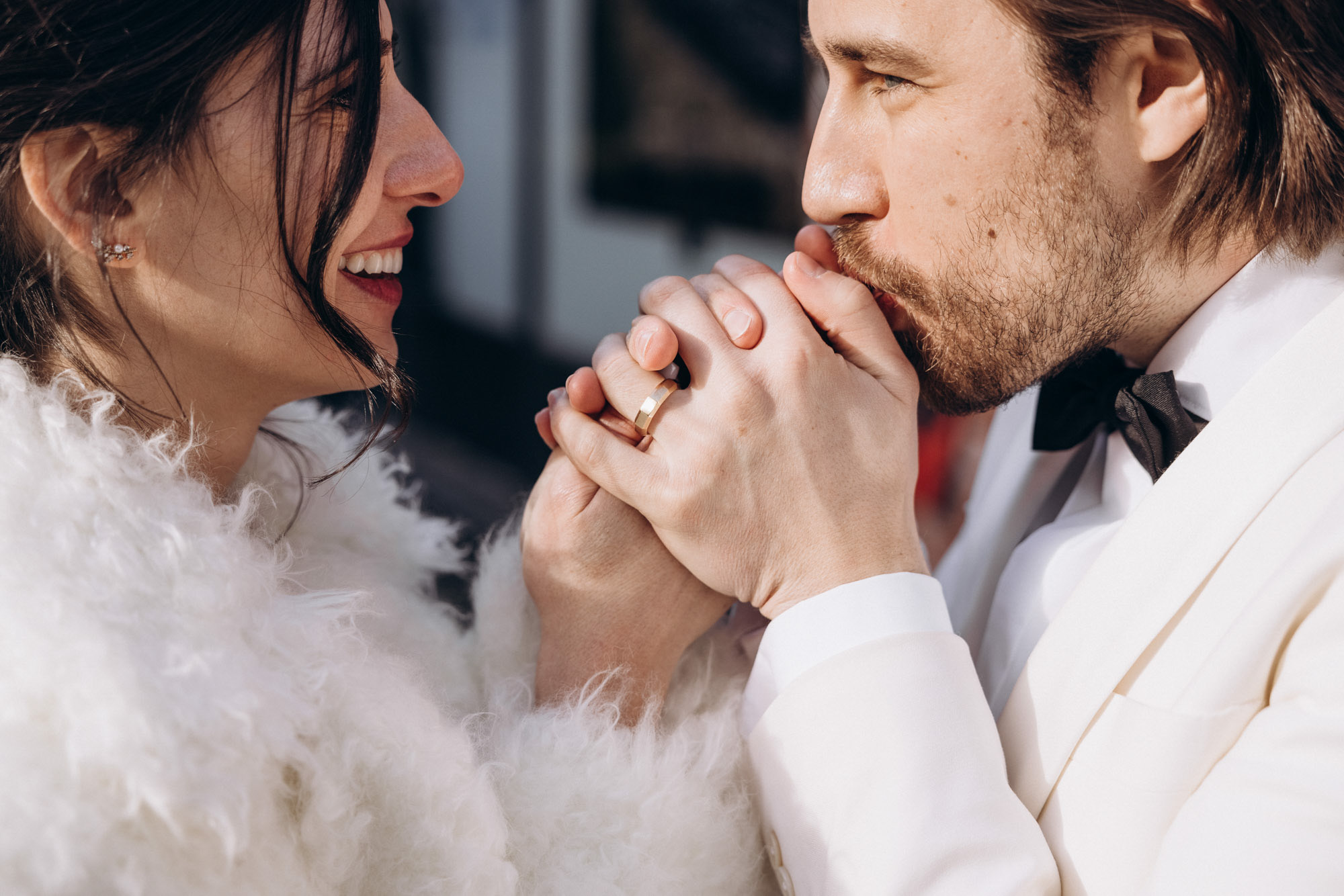 Groom keeping the bride's hands warm. Winter NYC elopement. 