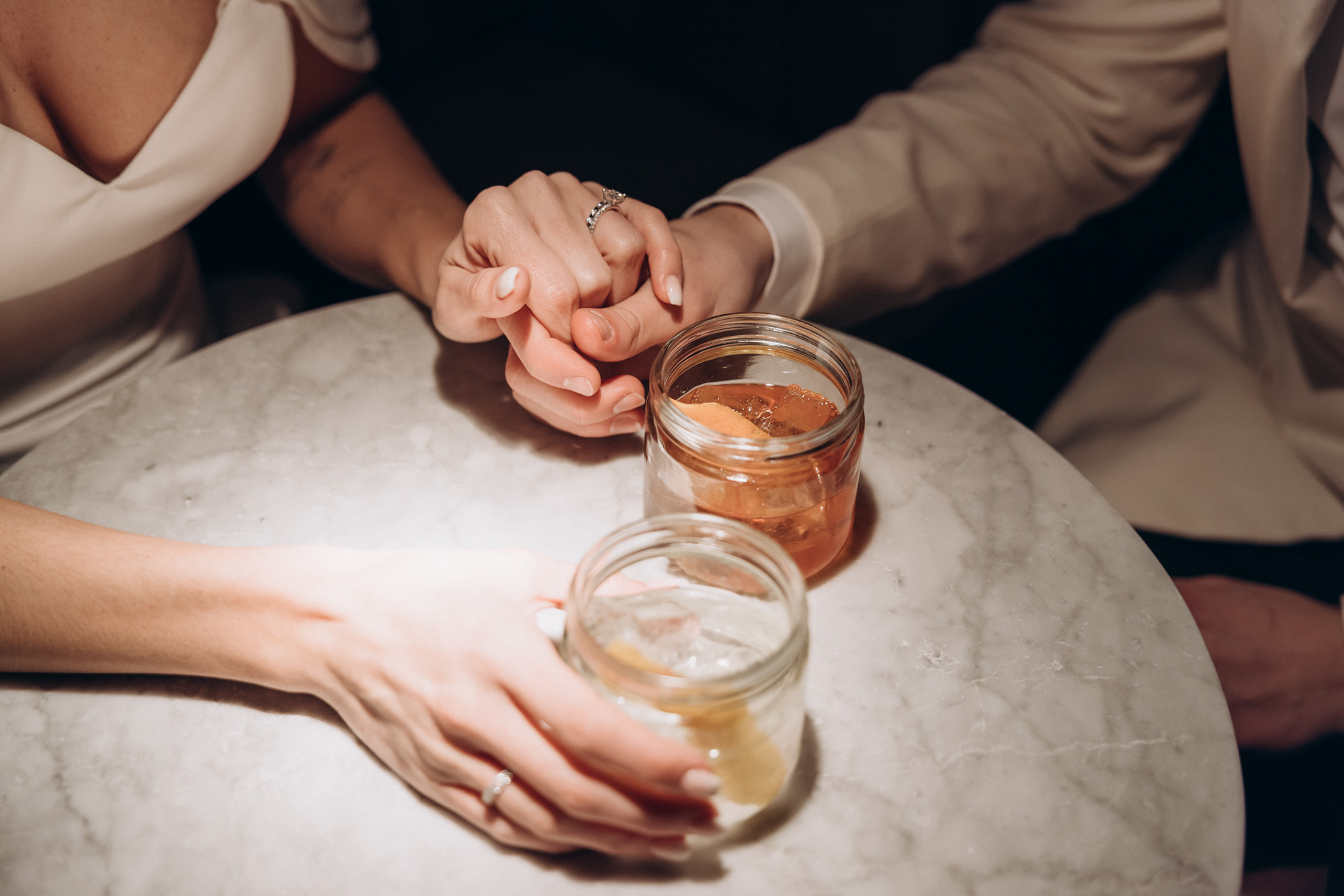 Drinks and hands. West Village. Manhattan NY