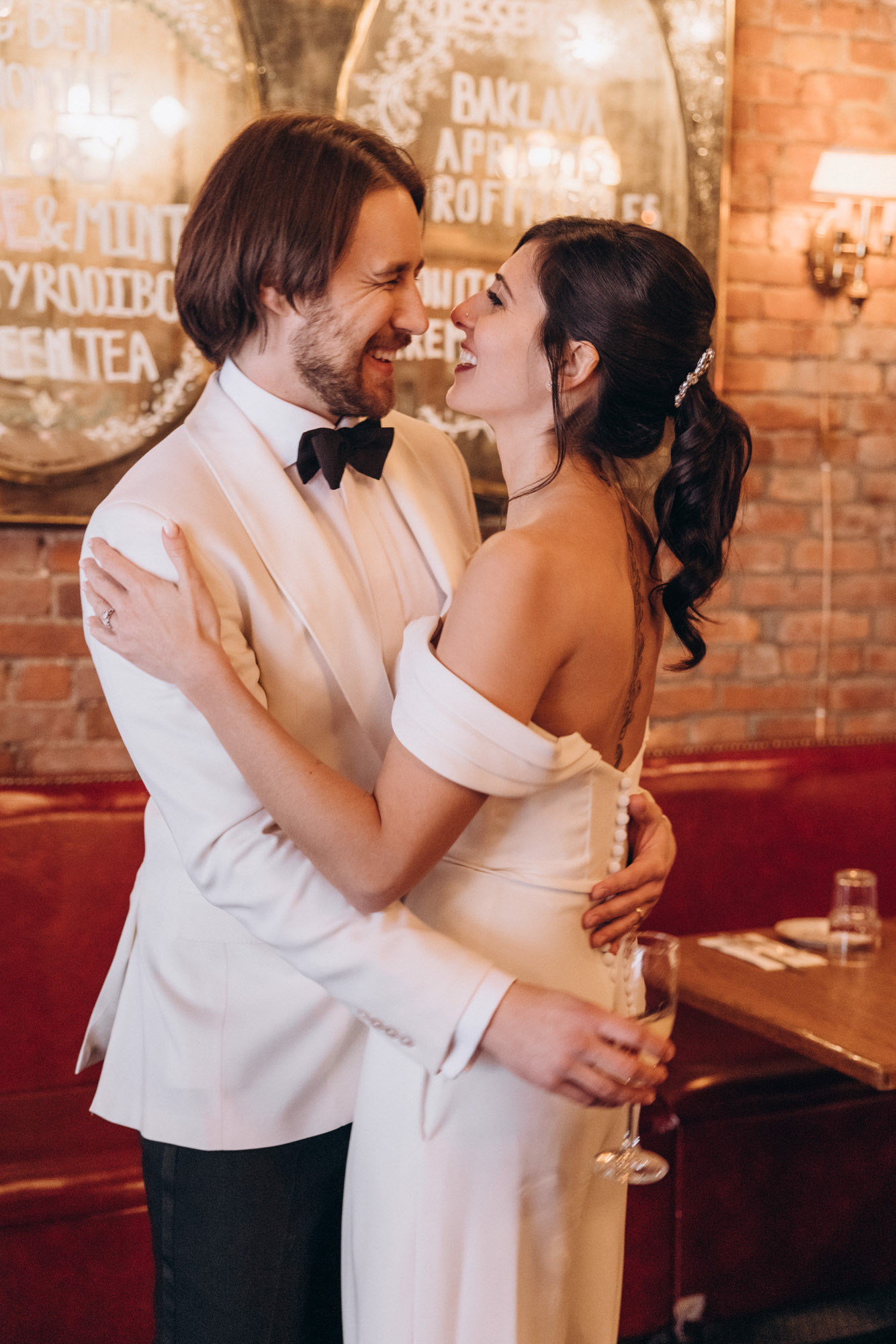 Bride and groom during their winter NYC elopement wedding day at a unique & vintage restaurant.. Soho, Manhattan, NY