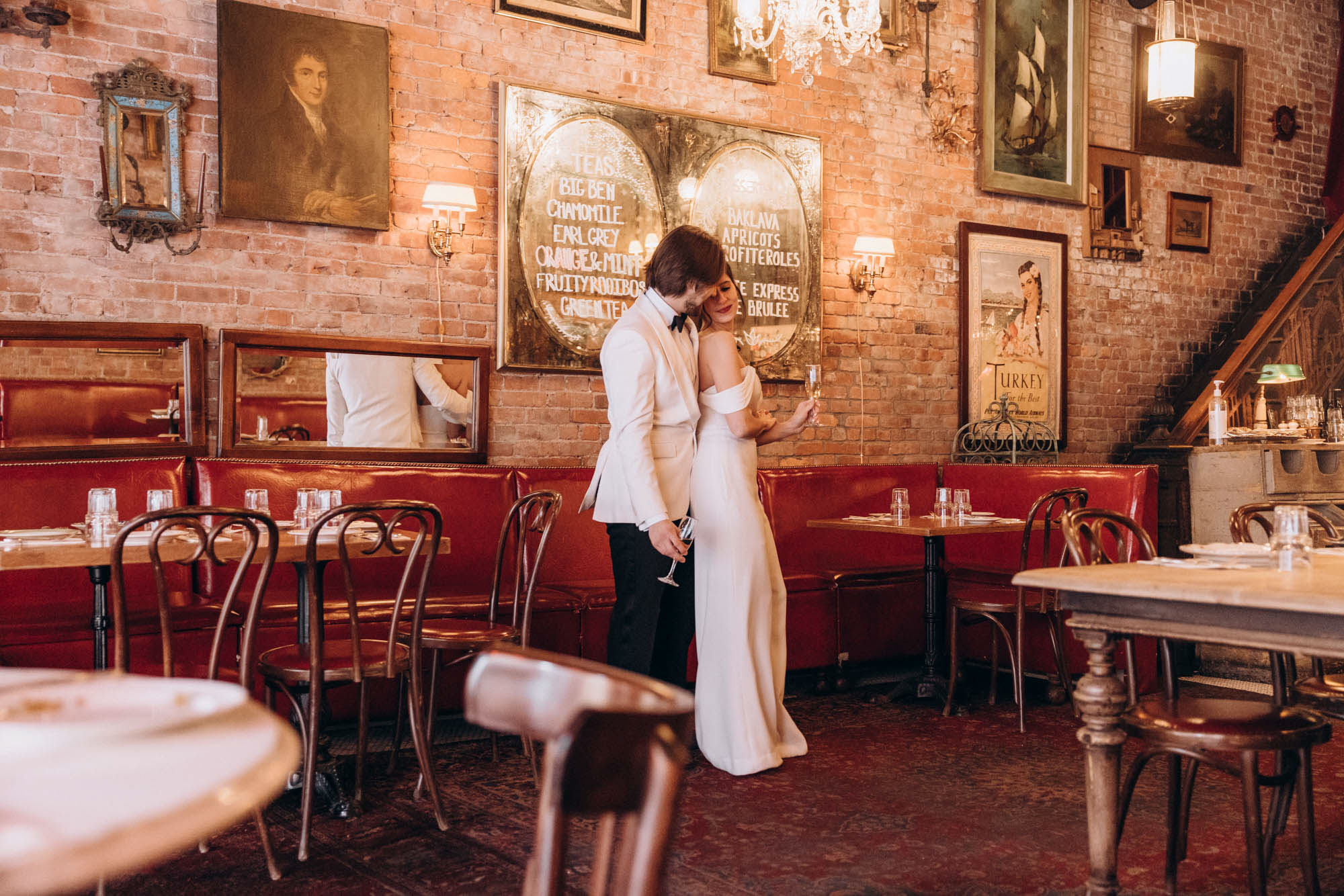 Bride and groom during their winter NYC elopement wedding day at a unique & vintage restaurant.. Soho, Manhattan, NY