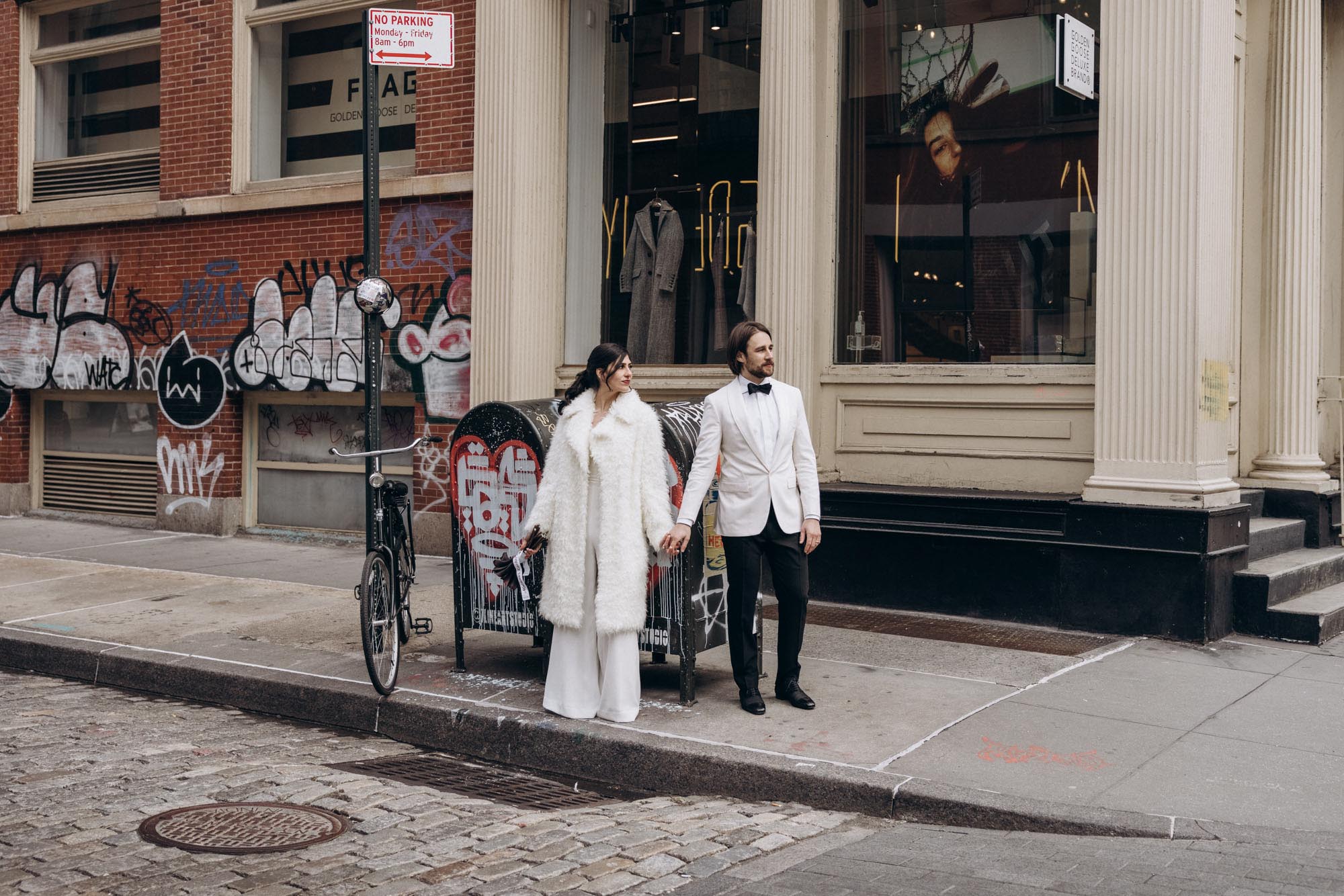 Stylish bride and groom during their winter NYC elopement in Soho. Manhattan NY