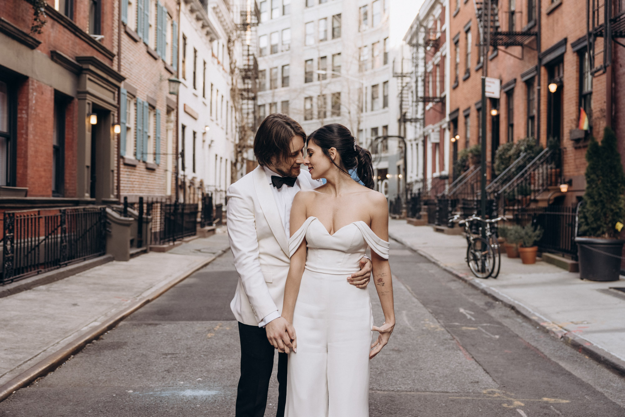 Stylish bride in a jumpsuit and groom in the West Village. Manhattan NY