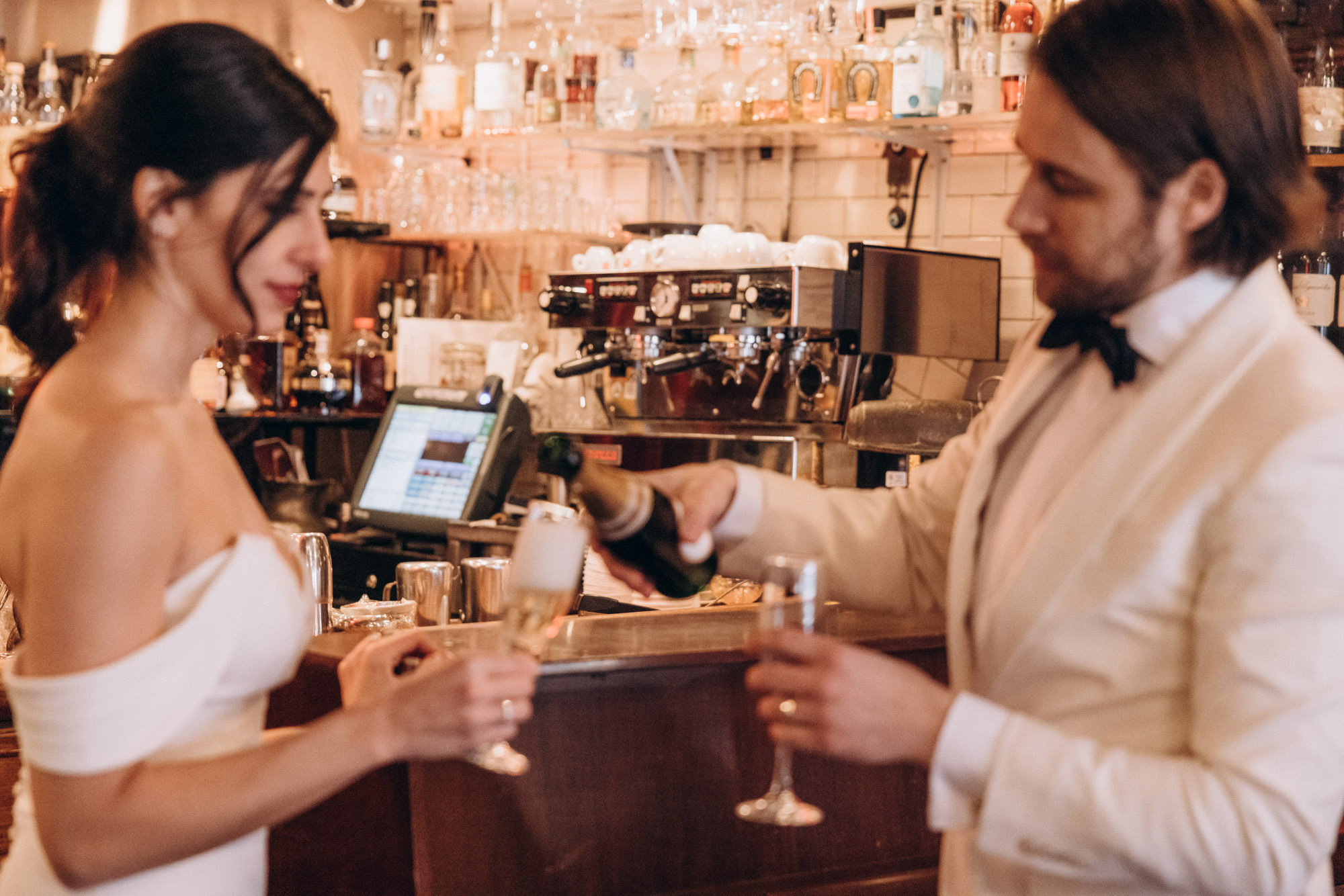 Bride and groom celebrate with drinks after their elopement ceremony, Soho, Manhattan, NY