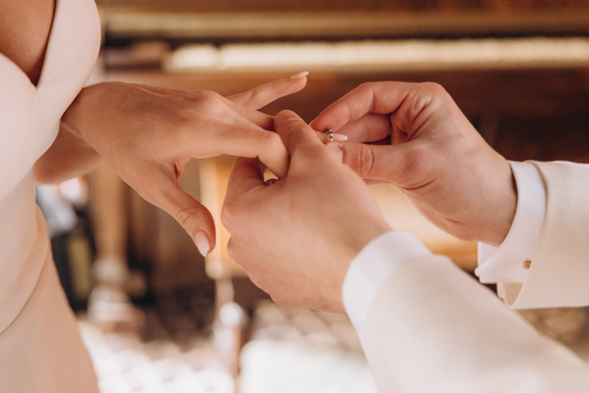 The ring exchange at a small elopement ceremony at the Bowery Hotel. Manhattan, NY