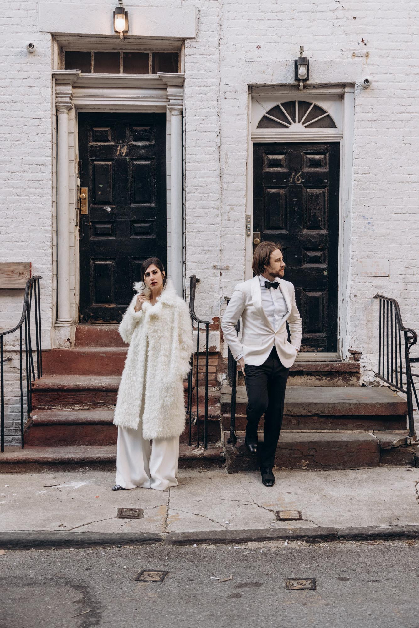 Stylish bride and groom in a fuzzy fur coat in the West Village. Manhattan NY