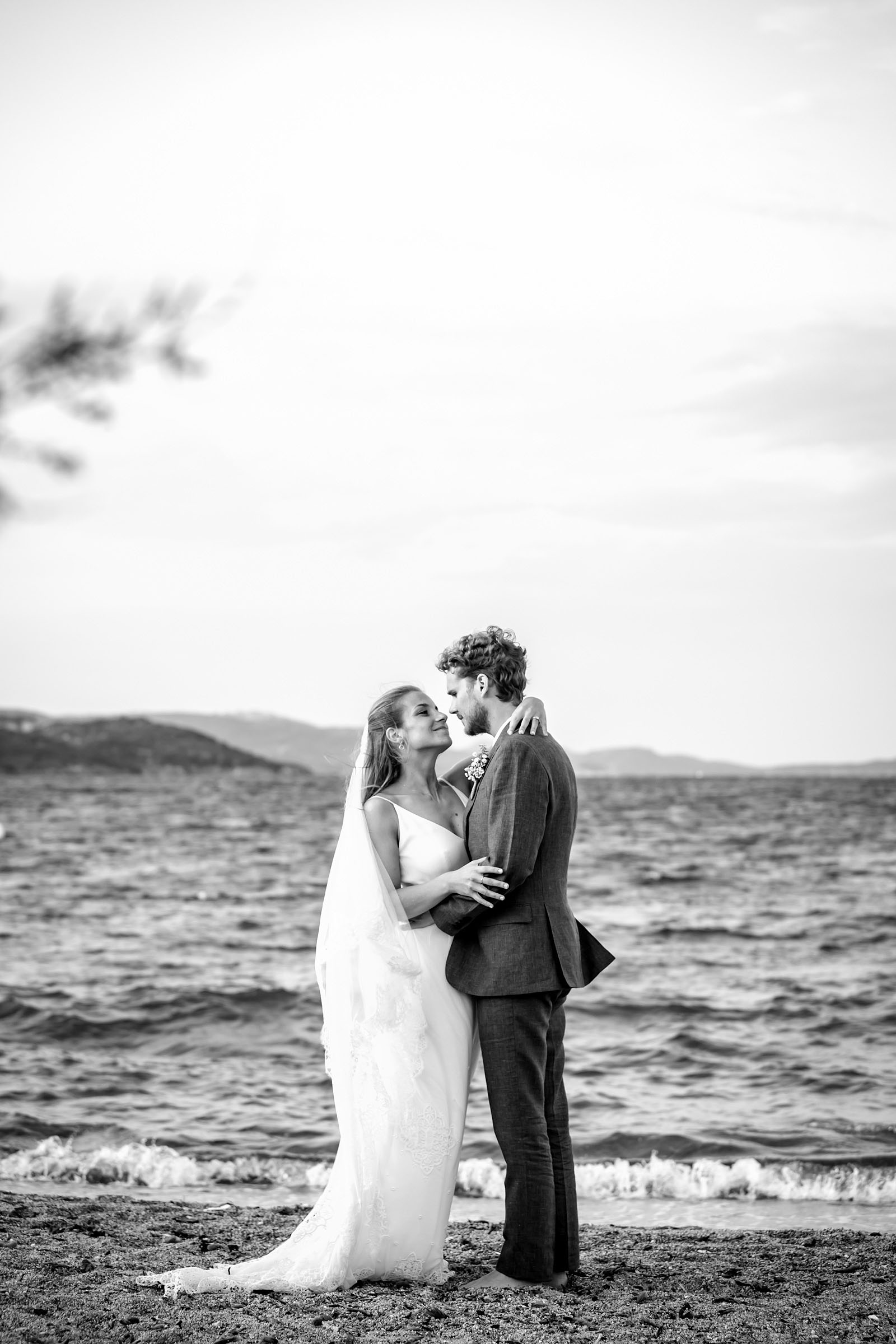 Wedding photo session - Just married bride and groom on a beach in Corsica shot by philarty